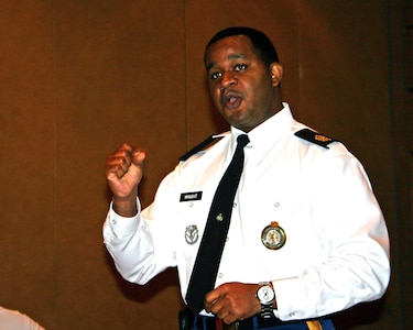 Sgt. Maj. Jerrell Wright, sergeant major of the Army National Guard Education, Incentives and Employment Division discusses eligibility requirements for applicants to attend the GED Plus Program to attendees of the 22nd Annual National Dropout Prevention Center/Network Conference in Philadelphia, Nov. 16, 2010.