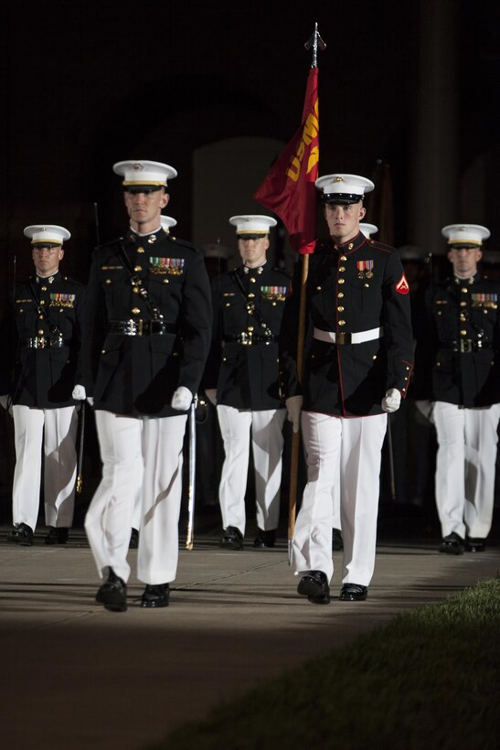 Marines with Marine Barracks Washington, D.C., perform during an evening parade May 8, 2015. The Evening Parade summer tradition began in 1934 and features the Silent Drill Platoon, the U.S. Marine Band, the U.S. Marine Drum and Bugle Corps and two marching companies. More than 3,500 guests attend the parade every week.
(U.S. Marine Corps photo by Lance Cpl. Hailey Stuart/Released)

