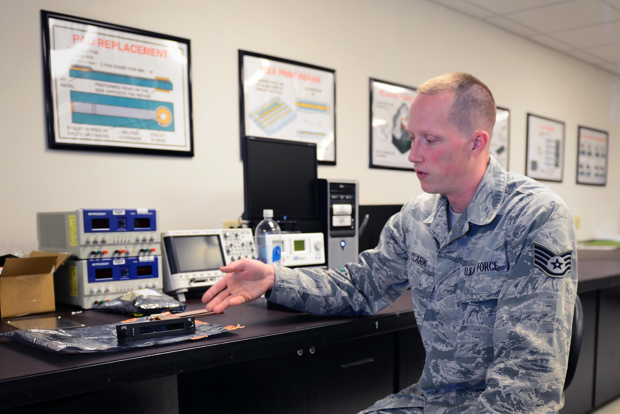 U.S. Air Force Staff Sgt. Paul Clark, 27th Special Operations Maintenance Group Air Force Repair Enhancement Program technician, reviews his process for repairing an LCD screen May 5, 2015 at Cannon Air Force Base, N.M. Clark trained in miniature and microminiature electronic repair, module test and repair, and electronic signal analysis courses before becoming a certified AFREP technician. (U.S. Air Force photo/Airman 1st Class Shelby Kay-Fantozzi)