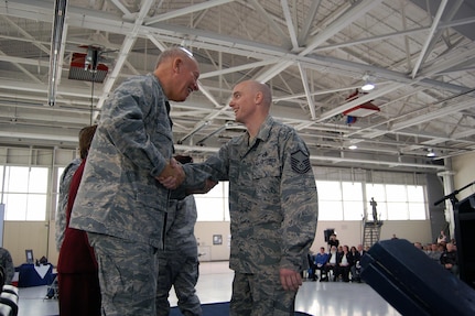 Air Force Lt. Gen. Harry “Bud” Wyatt III, director of the Air National Guard, thanks Master Sgt. Wesley Childress for his service during the 192nd Fighter Wing's first Hometown Heroes Ceremony held at Langley Air Force Base, Va., Dec. 4, 2010.