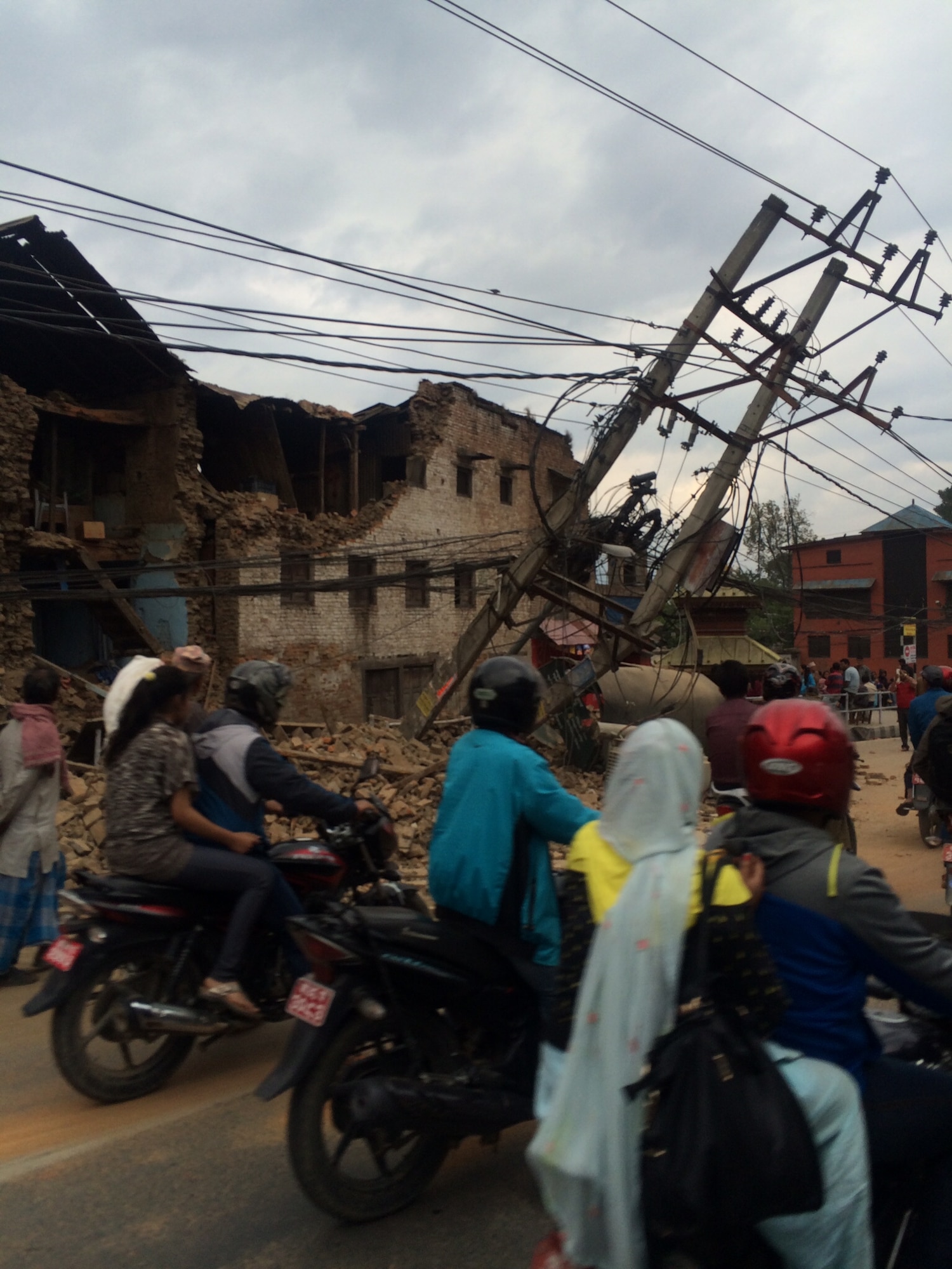 Residents travel down the streets of Kathmandu, Nepal, following the devastating 7.8 magnitude earthquake that damaged many parts of the country. (Courtesy photo)