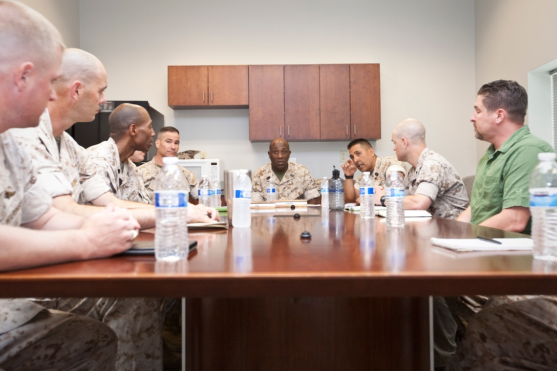 Sgt.Maj. Ronald L. Green, the 18th Sergeant Major of the Marine Corps, listens to a brief given by Marines assigned to the Marine Corps Embassy Security Group Headquarters at the Marine Corps Security School at Marine Corps Base Quantico in Quantico, VA, May 12, 2015. (U.S. Marine Corps photo by Sgt. Melissa Marnell)