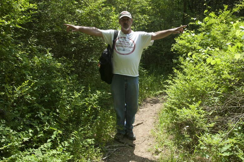 Native History Association President Pat Cummins stands on Twin Forks Horse Trail near the East Fork Recreation Area in Smyrna, Tenn., May 9, 2015 and announces he is standing on the rediscovered segment of the Trail of Tears.  Signs have been posted that mark the area where Cherokee Indians passed through the area in 1838 on the way to Indian Territory in present day Oklahoma.  Cummins recounted the first time he stood on that stretch of the trail and realized he was the first person, the first Cherokee, to knowingly visit this path in a very long time for the cause of preserving its history and recognizing its significance.