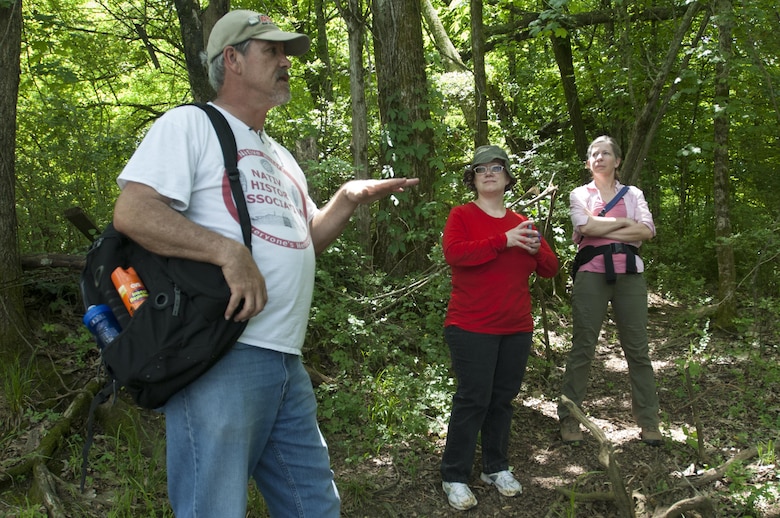 Native History Association President Pat Cummins (Left) talks about life in Old Jefferson on the shoreline of the Stones River during a tour May 9, 2015 of a rediscovered segment of the Trail of Tears that passed through where the town once thrived as a historical port and trading post in the early 1800s.  U.S. Army Corps of Engineers Nashville District employees Tammy Kirk (Center), librarian, and Valerie McCormack, archaeologist, listened to his presentation.