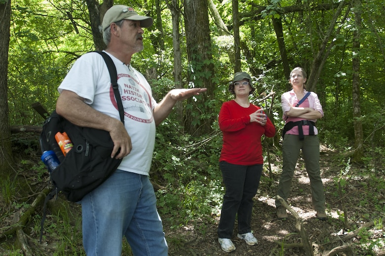 Native History Association President Pat Cummins (Left) talks about life in Old Jefferson on the shoreline of the Stones River during a tour May 9, 2015 of a rediscovered segment of the Trail of Tears that passed through where the town once thrived as a historical port and trading post in the early 1800s.  U.S. Army Corps of Engineers Nashville District employees Tammy Kirk (Center), librarian, and Valerie McCormack, archaeologist, listened to his presentation.