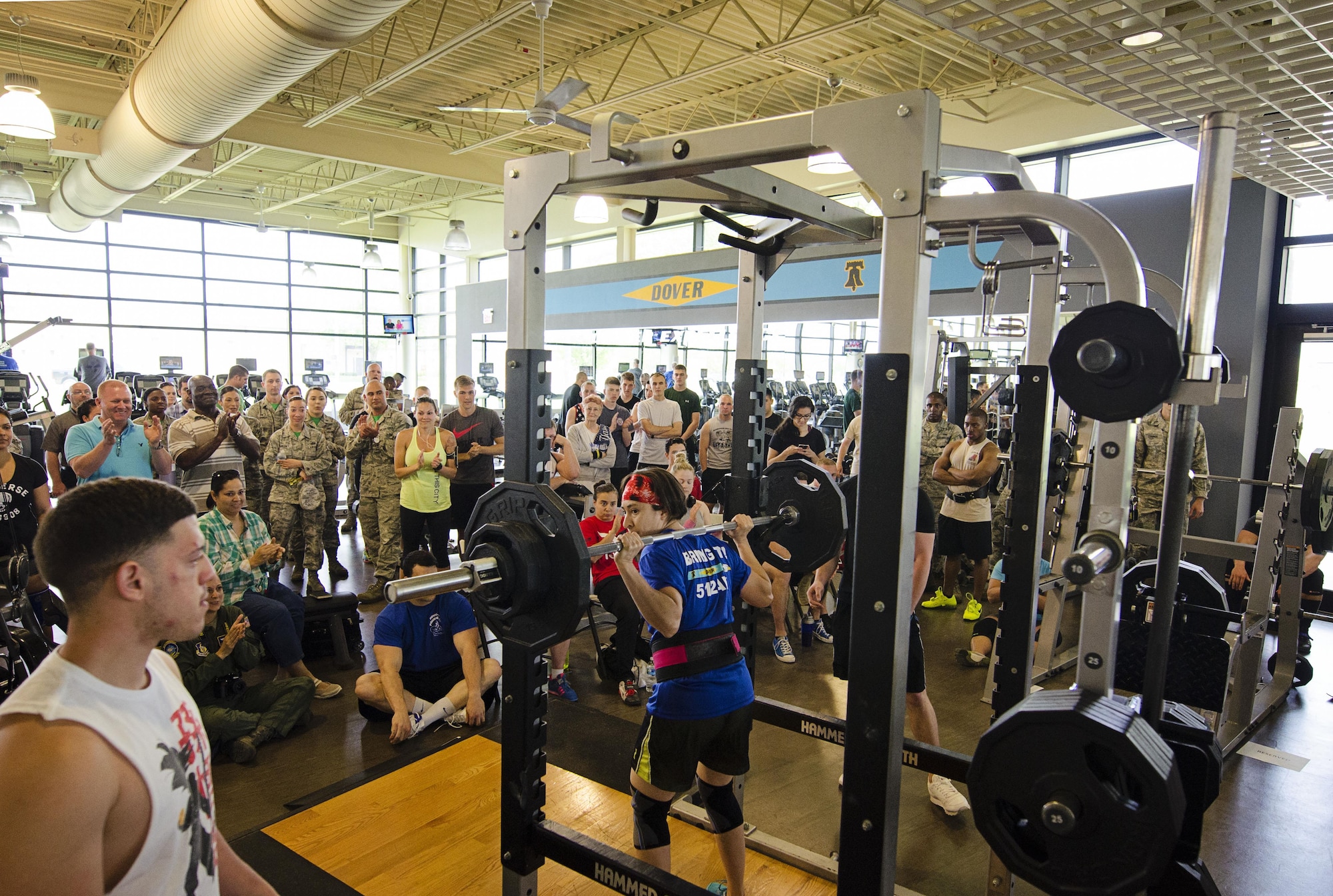 Liberty Wing reservist, Technical Sgt. Carolina Rodriquez from the 709th Airlift Squadron, racks the weights after successfully squatting 180 pounds. She along with roughly 20 competitors participated in the team dover powerlifting competition, consisting of squat, bench press and deadlift (U.S. Air Force photo by Capt. Bernie Kale)