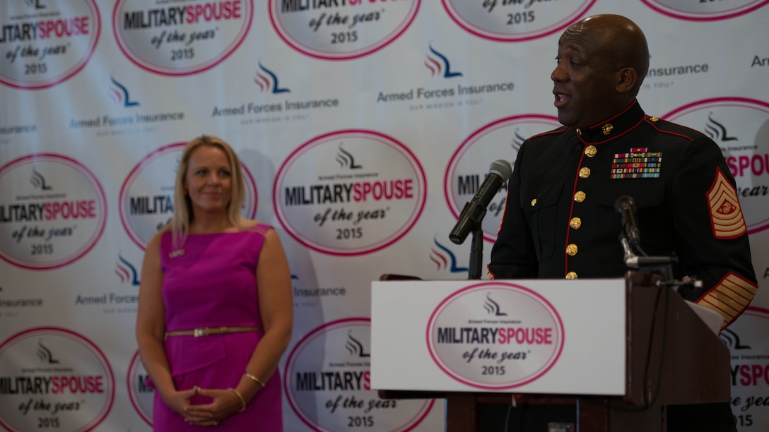 Sgt. Maj. Ronald Green, the 18th Sergeant Major of the Marine Corps, introduces Nicole Spaid the 2015 Armed Forces Insurance Marine Corps Spouse of the Year, at the 8th Annual Awards Luncheon at Joint Base Myer- Henderson Hall, May 8, 2015.

Spaid has overcome many obstacles in her life, including cancer, but has yet to stop reaching out to local spouses to encourage them to thrive.