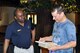 Air Force Reserve 910th Airlift Wing Chaplain Lt. Col. Klavens Noel talks with a participant during registration at a local Yellow Ribbon Program event at the Kalahari resort here, May 8, 2015. The 910th, based at nearby Youngstown Air Reserve Station, Ohio (YARS), hosted the May 8 – 10, 2015 event which was attended by more than 90 Citizen Airmen and their family members. The Yellow Ribbon Program is mandated by the U.S. Congress and is designed to provide tools to Servicemembers and their families to aid them before, during and after an extended military tour. (U.S. Air Force photo/Master Sgt. Bob Barko Jr.)