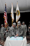Maj. Gen. Nelson J. Cannon, left, commanding general for detainee operations
and provost marshal general with United States Forces-Iraq, and Pfc. Jacob
Wood, with Troop B, 2nd Squadron, 116th Garrison Command, U.S.
Division-Center, cut a cake with a sabre to celebrate the National Guard's
374th birthday inside Al Faw Palace at Camp Victory, Iraq, Dec. 13, 2010.
Cannon is currently the most senior ranking National Guard service member
and Wood is currently the most junior ranking National Guard service member
at Victory Base Complex, Iraq.