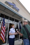 Senior Master Sgt. Lorenda Thomas, of the South Carolina Air National Guard, celebrates the grand opening of the 169th Fighter Wing’s first recruiting storefront location on March 25, 2009.