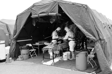 The 388th Chemical Biological Radiological Nuclear Company show no signs of complacency during a Mass Casualty Decontamination training event during Battle Assembly at Fort McCoy and Volk Field, Wis., May 8-10. CBRN Soldiers responded to a training scenario incident, coordinate with local and federal officials, contain the situation, identify the chemicals or toxins, all while safely evacuating and treating the effected population. The 388th CBRN Company, headquartered in Junction city, Wis., is in the second phase of a multi-year mission to support the Department of Homeland Security. Army North instructors continue to provide  388th Soldiers with hands on training, equipment, and experience to assist military and civil authorities in the event of a natural disaster, chemical emergency, or terrorist attack within the United States.