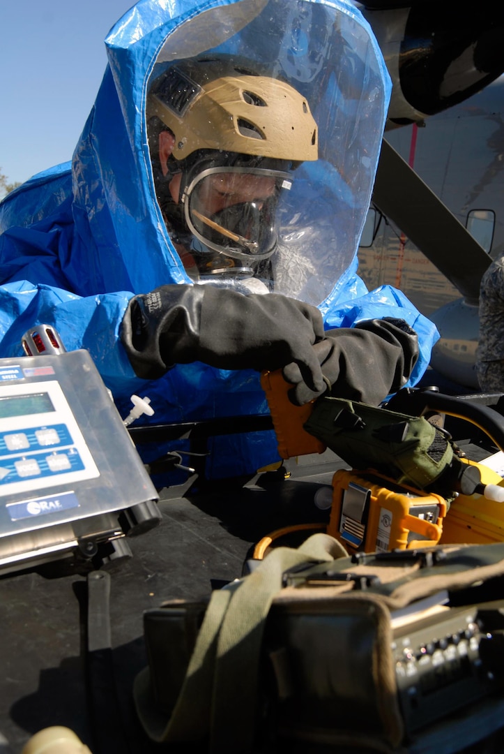 Sgt. Matt Mitchell of the Florida National Guard's 48th Civil Support Team prepares equipment to take chemical samples during a weapons of mass destruction evaluation in Brooksville, Fla., Dec. 16, 2010.
