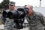 Air Force Gen. Craig McKinley, the chief of the National Guard Bureau, right, talks with a California National Guardsman about surveillance technology near San Diego, Calif., during a Dec. 14, 2010, visit to review the National Guard's support to Customs and Border Protection and Immigration and Customs Enforcement through Joint Task Force-Sierra. 