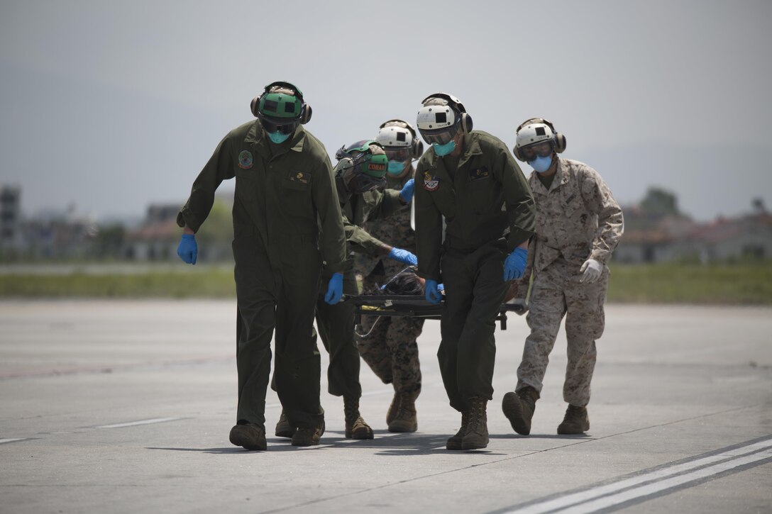 U.S. Marines carry a Nepalese woman to a triage at the Tribhuvan International Airport in Kathmandu, Nepal, May 13. Joint Task Force 505 service members are in Nepal conducting earthquake recovery operations as part of Operation Sahayogi Haat. A 7.3 magnitude earthquake shook the country May 12, nearly two weeks after a larger earthquake struck April 25.