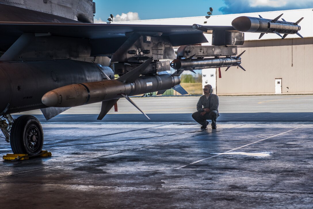 U.S. Air Force Staff Sgt. Cody Puente, a 35th Aircraft Maintenance Squadron crew chief deployed from Misawa Air Base, Japan, prepares a 13th Fighter Squadron F-16 Fighting Falcon on Eielson Air Force Base, Alaska, May 12, 2015, during RED FLAG-Alaska (RF-A) 15-2. RF-A is a series of Pacific Air Forces commander-directed field training exercises for U.S. and partner nation forces, providing combined offensive counter-air, interdiction, close air support and large force employment training in a simulated combat environment. (U.S. Air Force photo by Staff Sgt. Joshua Turner/Released)