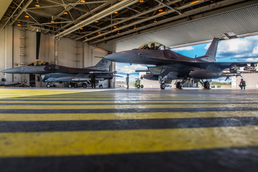 U.S. Air Force Staff Sgt. Cody Puente, a 35th Aircraft Maintenance Squadron crew chief deployed from Misawa Air Base, Japan, prepares a 13th Fighter Squadron F-16 Fighting Falcon on Eielson Air Force Base, Alaska, May 12, 2015, during RED FLAG-Alaska (RF-A) 15-2. RF-A is a series of Pacific Air Forces commander-directed field training exercises for U.S. and partner nation forces, providing combined offensive counter-air, interdiction, close air support and large force employment training in a simulated combat environment. (U.S. Air Force photo by Staff Sgt. Joshua Turner/Released)