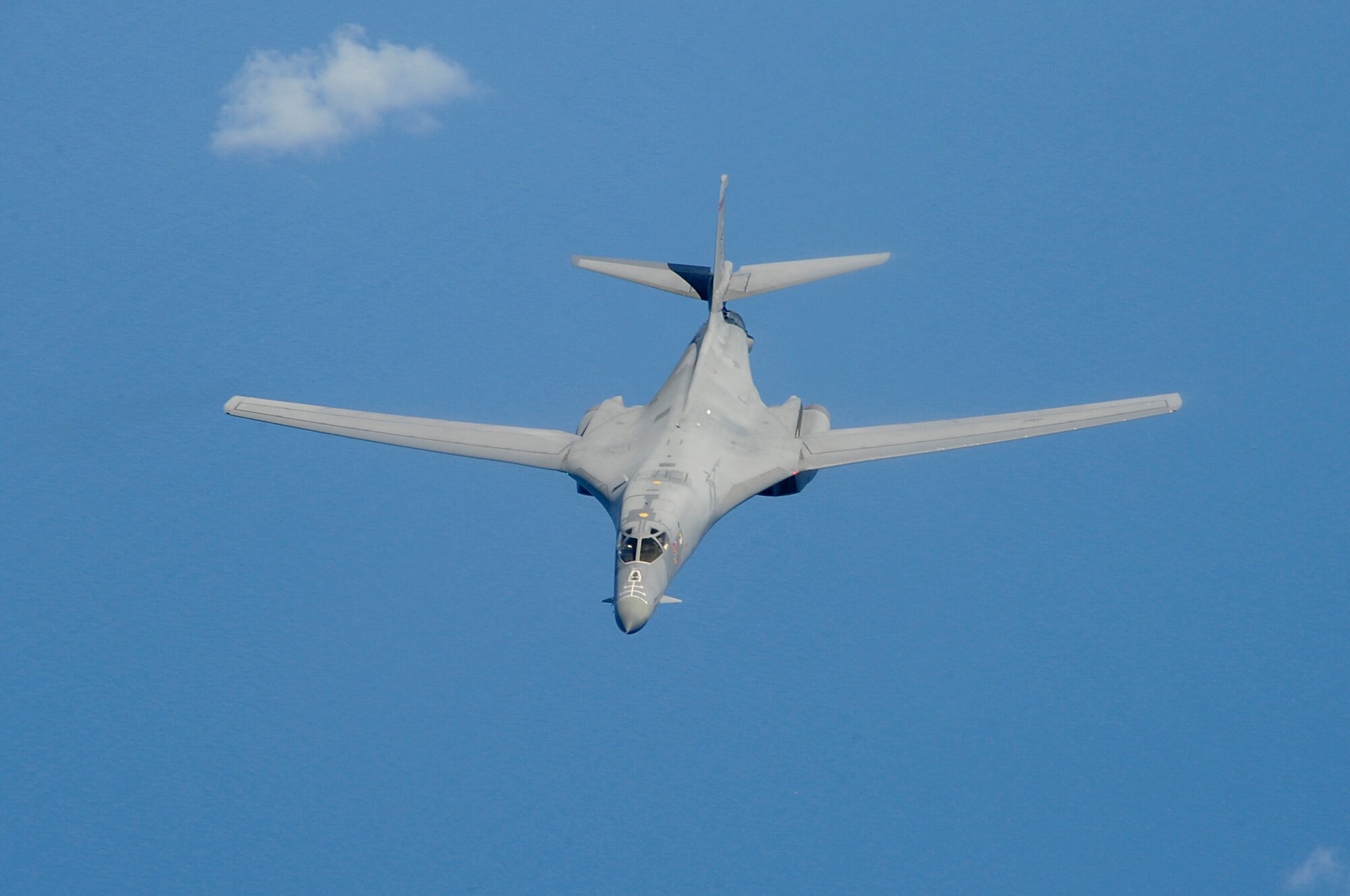 A U.S. Air Force B-1B Lancer bomber belonging to Dyess Air Force Base, Texas, flies through the sky after refueling during a training sortie involving aircraft from Dyess and Kadena Air Base, Japan, May 8, 2015. During this training, a Kadena-based KC-135 Stratotanker from the 909th Air Refueling Squadron traveled to Guam to allow crews from both aircraft to practice refueling procedures. (U.S. Air Force photo by Tech. Sgt. Darnell T. Cannady)