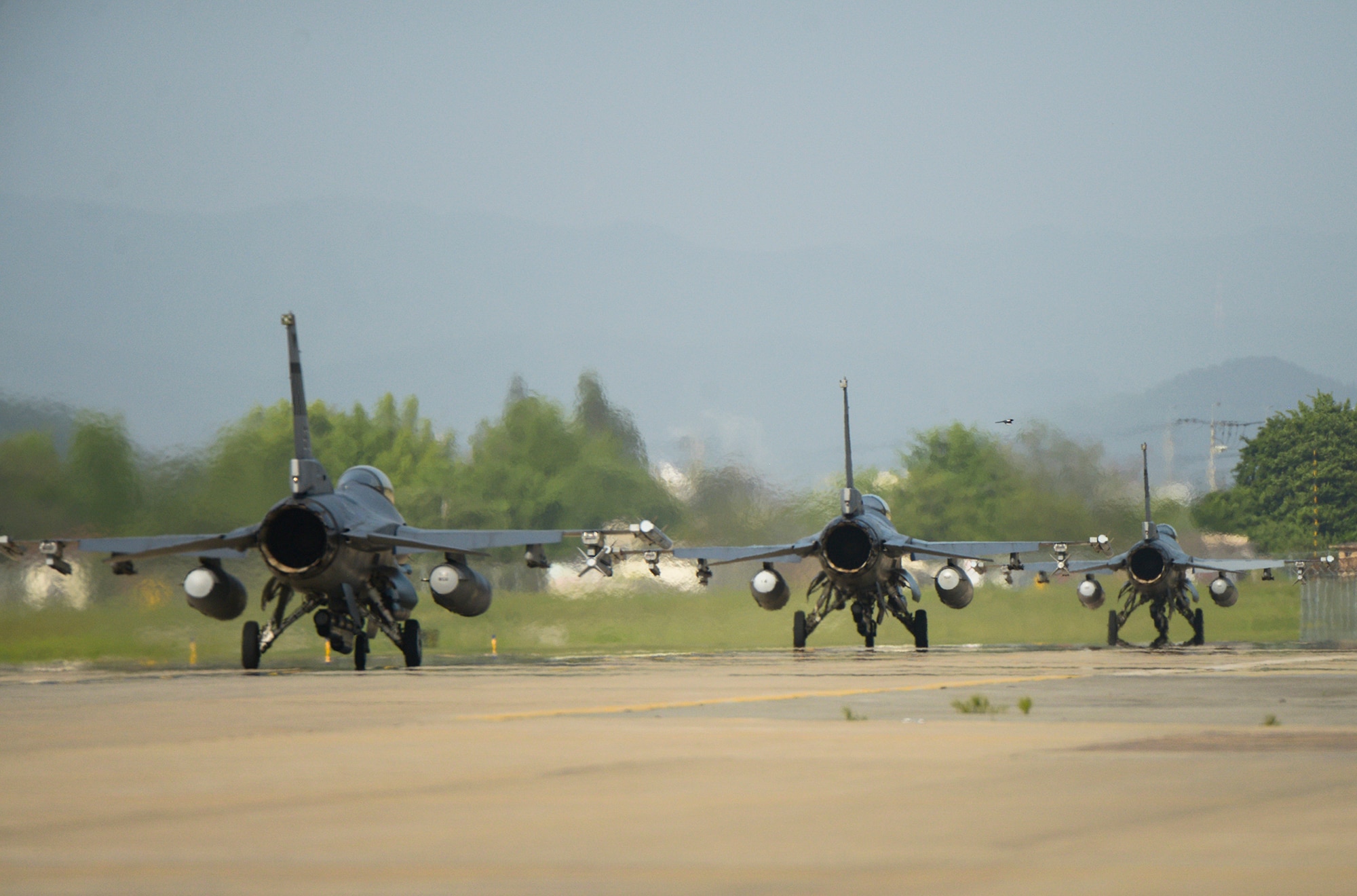 F-16s taxi on the runway during operational readiness exercise Beverly Midnight 15-02 May 13, 2015, at Osan Air Base, Republic of Korea. The ORE was part of Team Osan's quarterly exercises which test the base's readiness. (U.S. Air Force photo by Staff Sgt. Jake Barreiro)
