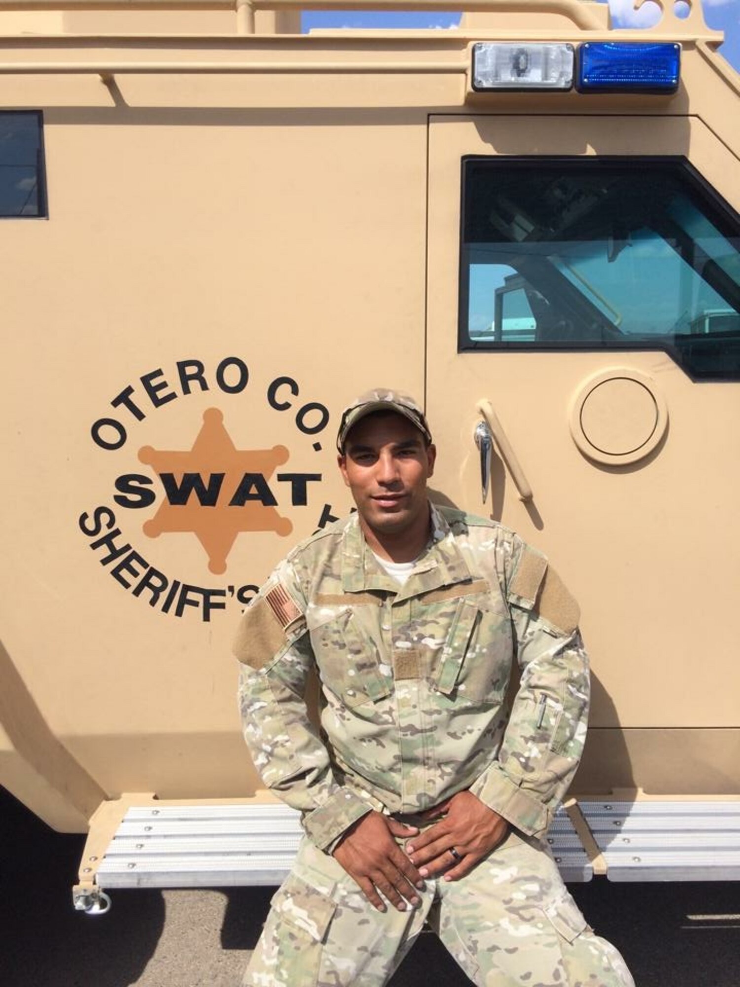 Staff Sgt. Anthony Harmon, 49th Security Forces Squadron Special Reaction Team, entry team leader poses for a photo in front of an Otero County Sheriff’s Department SWAT vehicle. Harmon, who has been on Holloman’s SRT since 2014, said one of his favorite parts of his job is training with various state and federal agencies. (Courtesy Photo)  