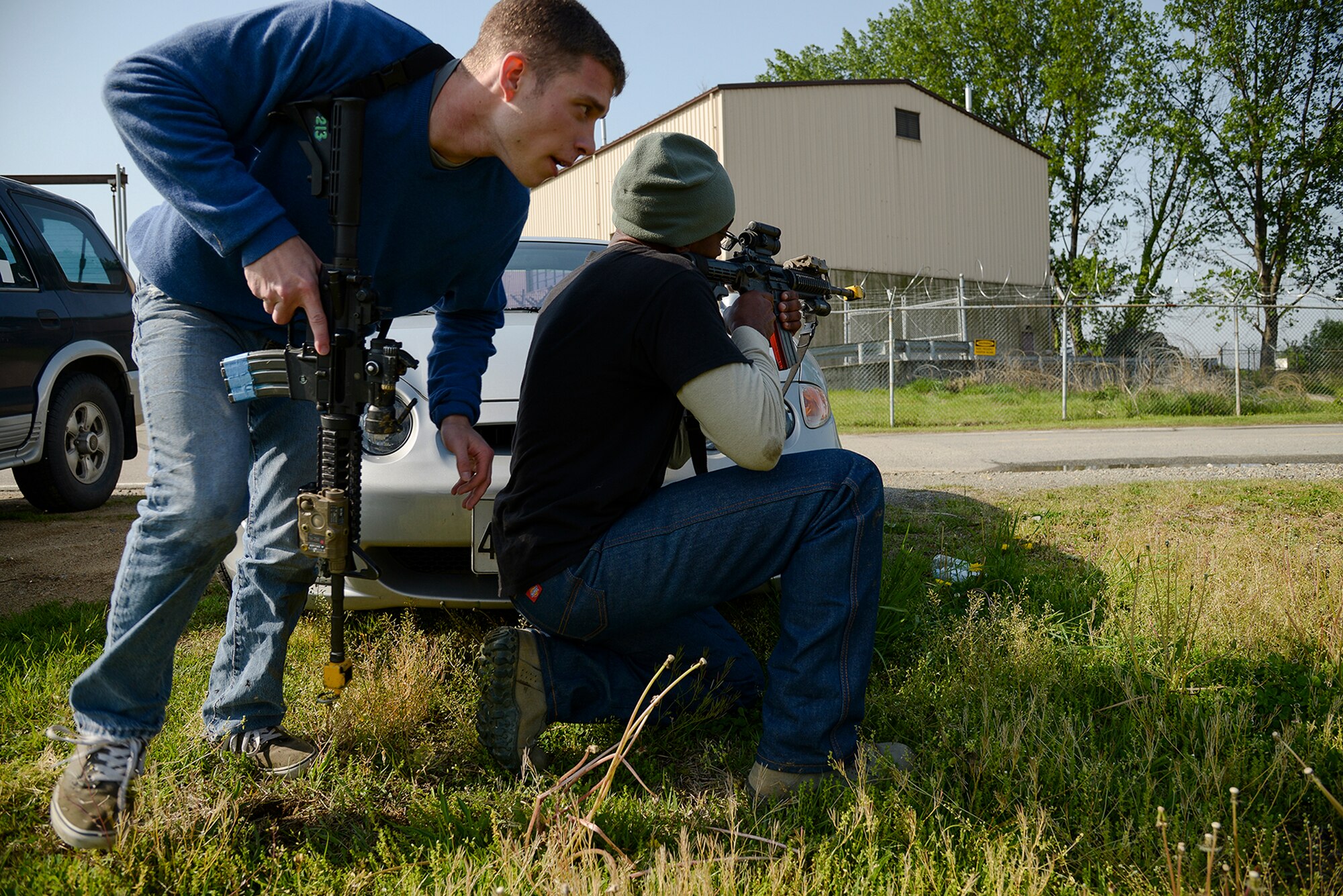 Airmen simulating opposition forces cover and maneuver during a scenario for operational readiness exercise Beverly Midnight 15-02 May 13, 2015, at Osan Air Base, Republic of Korea. The scenario included coordination between the U.S. Air Force, Army, and ROK Army. (U.S. Air Force photo by Staff Sgt. Jake Barreiro