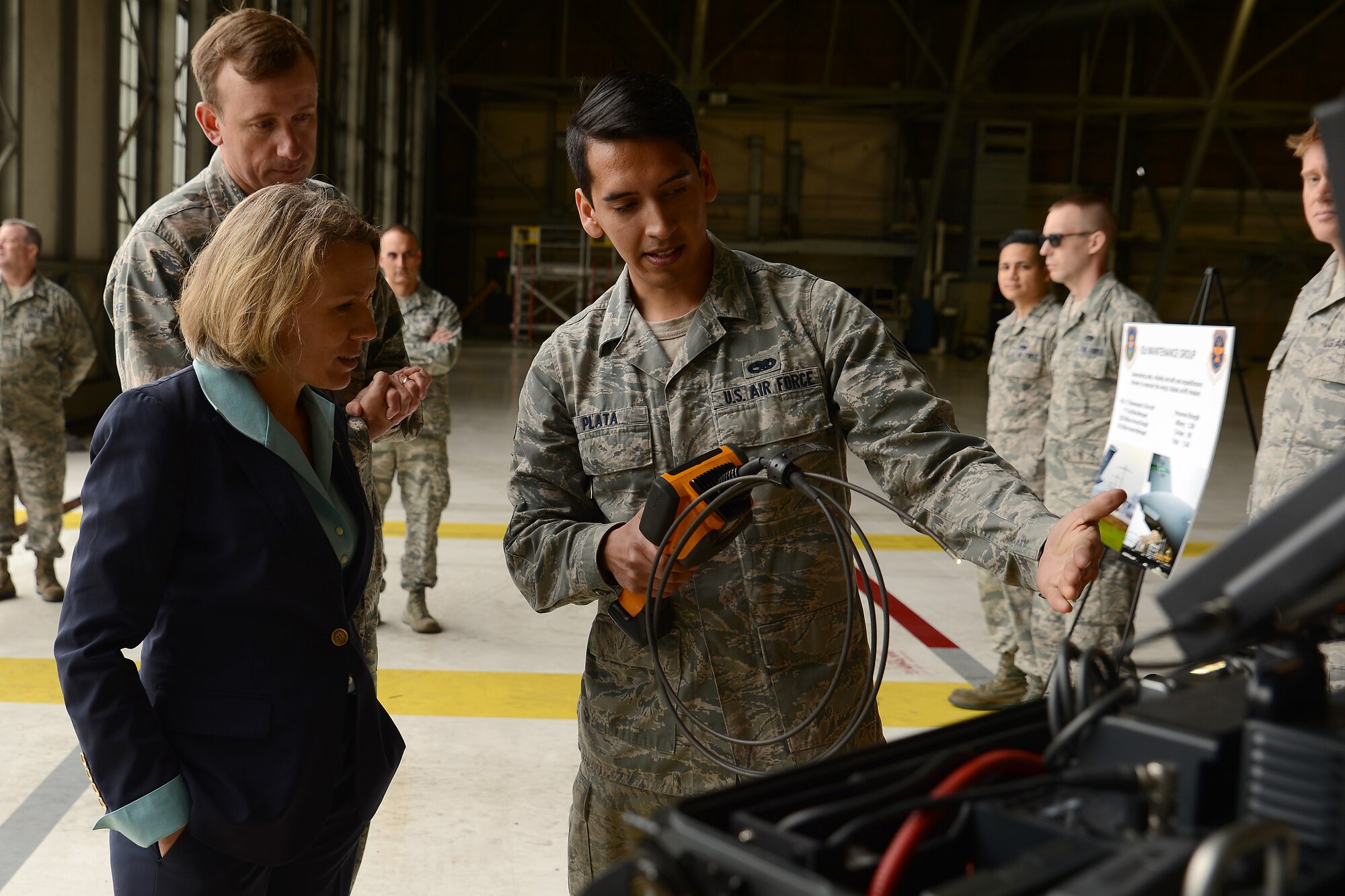 Senior Airmen Anthony Plata, 62nd Maintenance Squadron, shows Miranda Ballentine, assistant secretary of the Air Force for installations, environment, and energy, tools used for engine repair, May 11, 2015, at Joint Base Lewis-McChord, Wash. 62nd MXS completes more than 100 home station checks on C-17 Globemaster IIIs and 10,000 flight line maintenance actions annually. (U.S. Air Force photo\ Staff Sgt. Tim Chacon)
