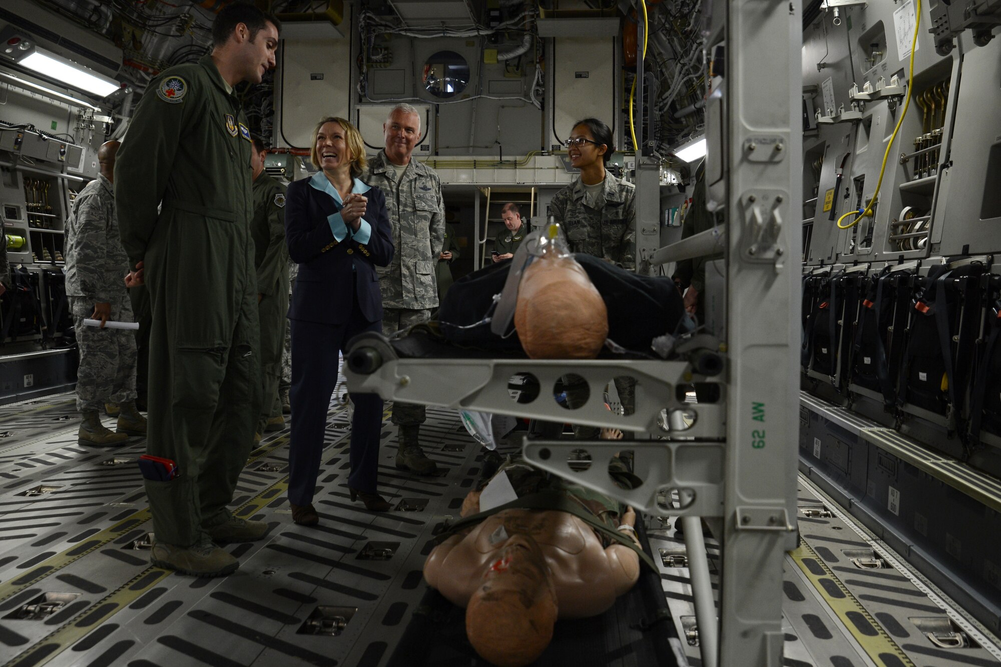 Airmen from the 446th Airlift Wing brief Miranda Ballentine, assistant secretary of the Air Force for installations, environment, and energy, on their aeromedical evacuation mission May 11, 2015, at Joint Base Lewis-McChord, Wash. The 2,100 Airmen assigned to the 446th AW perform 44 percent of the C-17 Globemaster III missions from JBLM.  (U.S. Air Force photo\ Staff Sgt. Tim Chacon)
