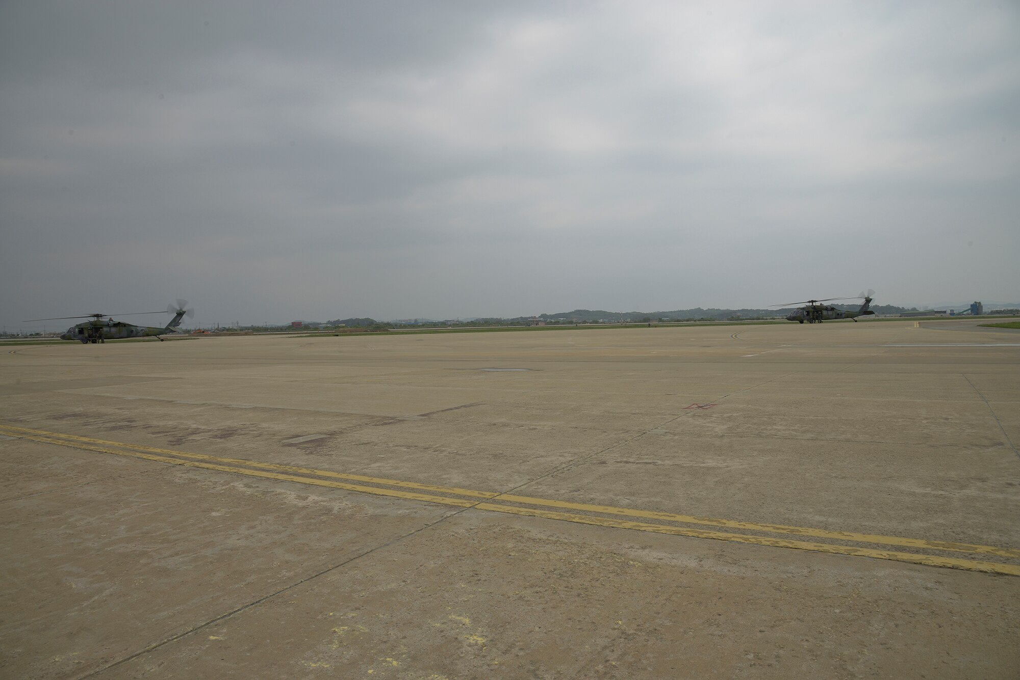 Helciopters carrying with Republic of Korean Army special forces sit on the flightline May 12, 2015, at Osan Air Base, Republic of Korea. The forces were training with 51st Security Forces Squadron Airmen during operational readiness exercise Beverly Midnight 15-02. (U.S. Air Force photo by Staff Sgt. Jake Barreiro)