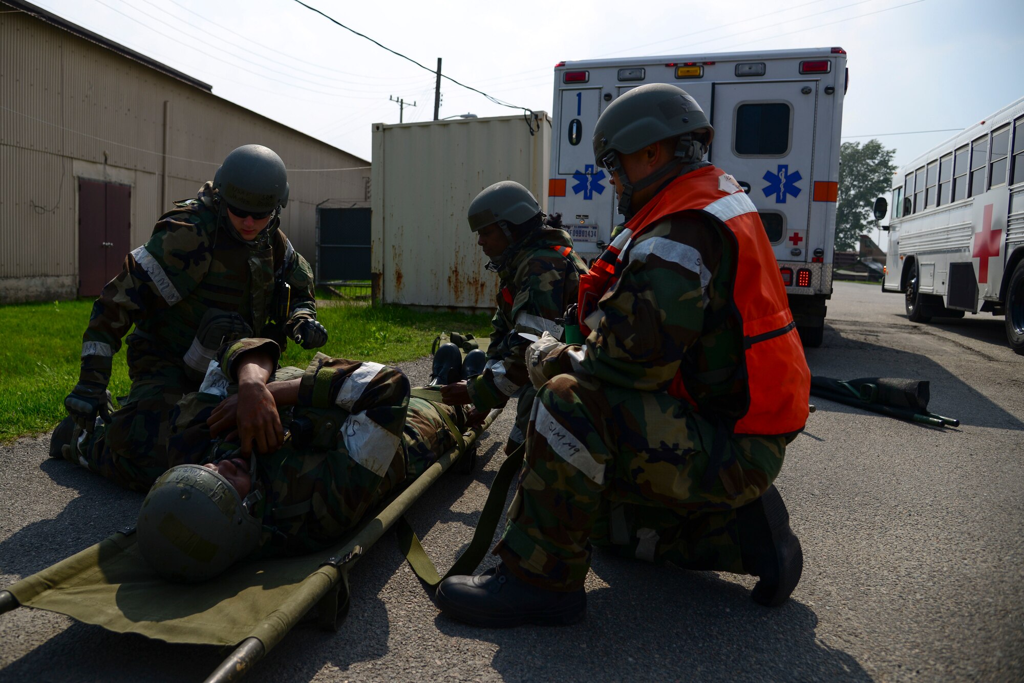 Medical Airman strap a casualty onto a litter in a mass casualty exercise during Beverly Midnight 15-2 May 12, 2015 at Osan Air Base, Republic of Korea. The exercise focuses on readiness, testing Osan’s wartime procedures, and realistically looking at our ability to defend the base, execute operations and receive follow-on forces. (U.S. Air Force photo by Senior Airman Matthew Lancaster)