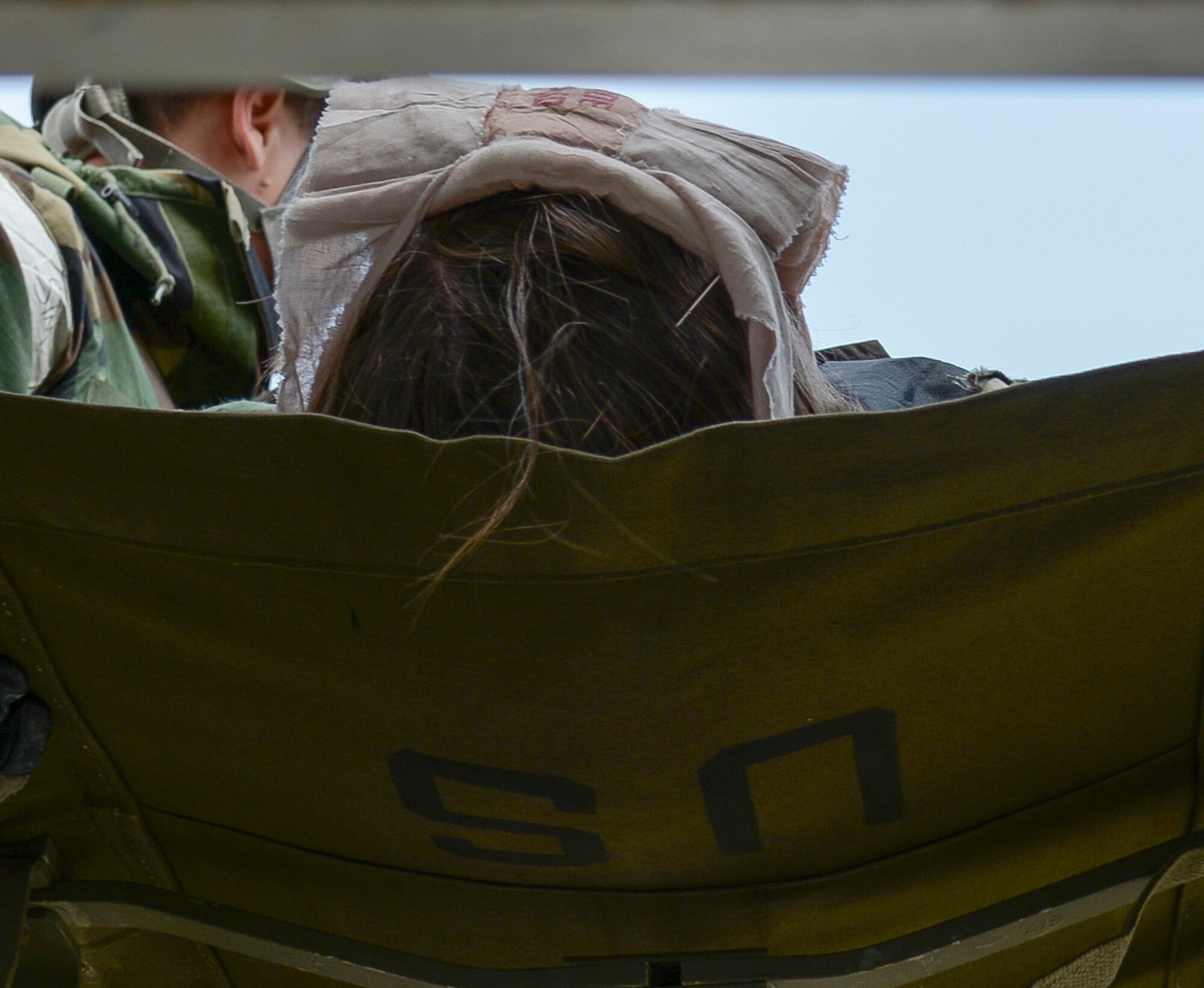 A simulated wounded Airman is loaded onto an ambulance during a mass casualty exercise May 12, 2015, at Osan Air Base, Republic of Korea. The simulation was part of Beverly Midnight 15-02, an operational readiness exercise designed to test the capabilities of Team Osan. (U.S. Air Force photo by Staff Sgt. Jake Barreiro/Released)