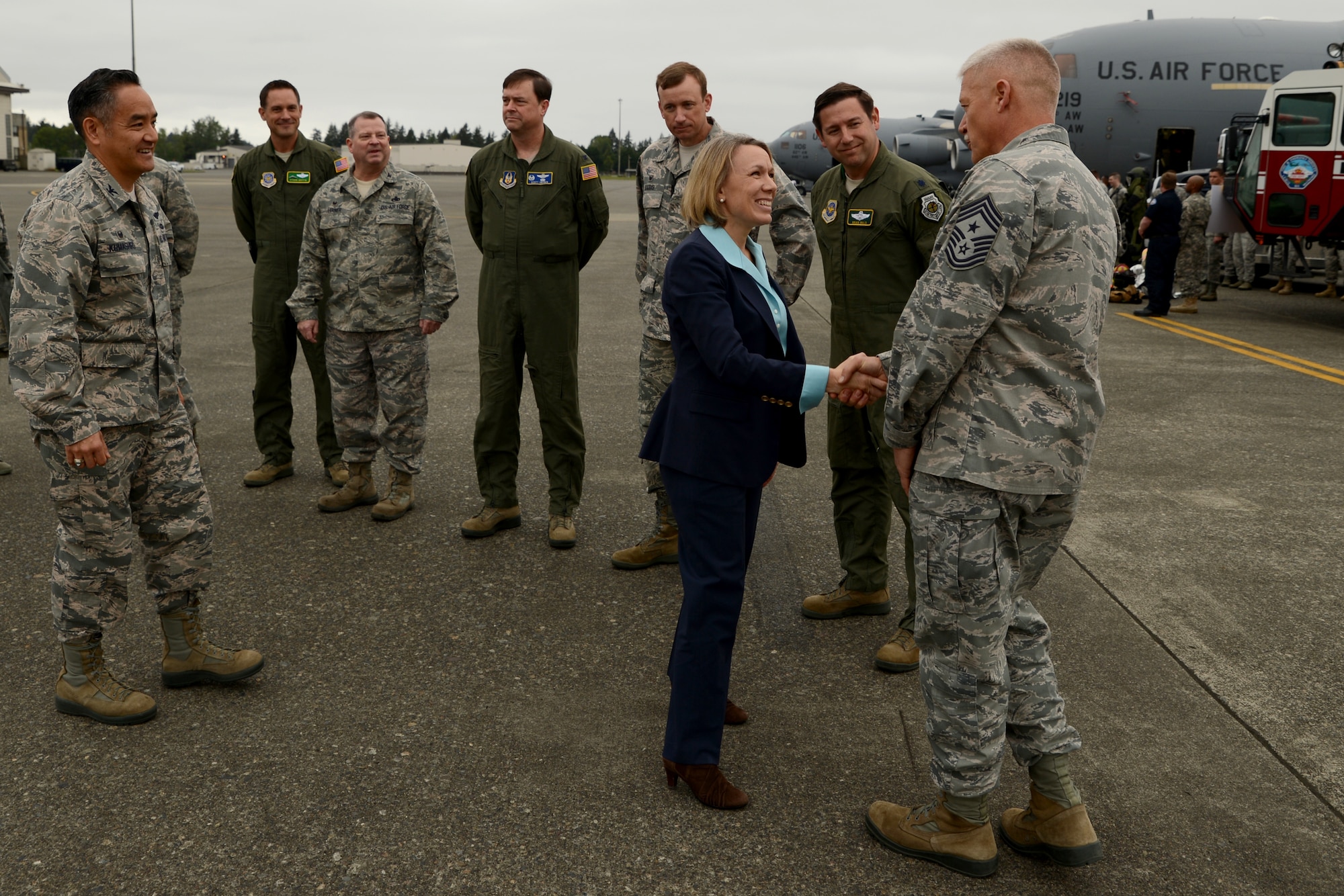 Chief Master Sgt. Gordon Drake(right), 62nd Airlift Wing command chief, welcomes Miranda Ballentine, assistant secretary of the Air Force for installations, environment, and energy, May 11, 2015, to Joint Base Lewis-McChord, Wash. Ballentine is responsible for the oversight, formulation, review and execution of plans, policies, programs and budgets for installations, energy, environment, safety and occupational health.   (U.S. Air Force photo\ Staff Sgt. Tim Chacon)