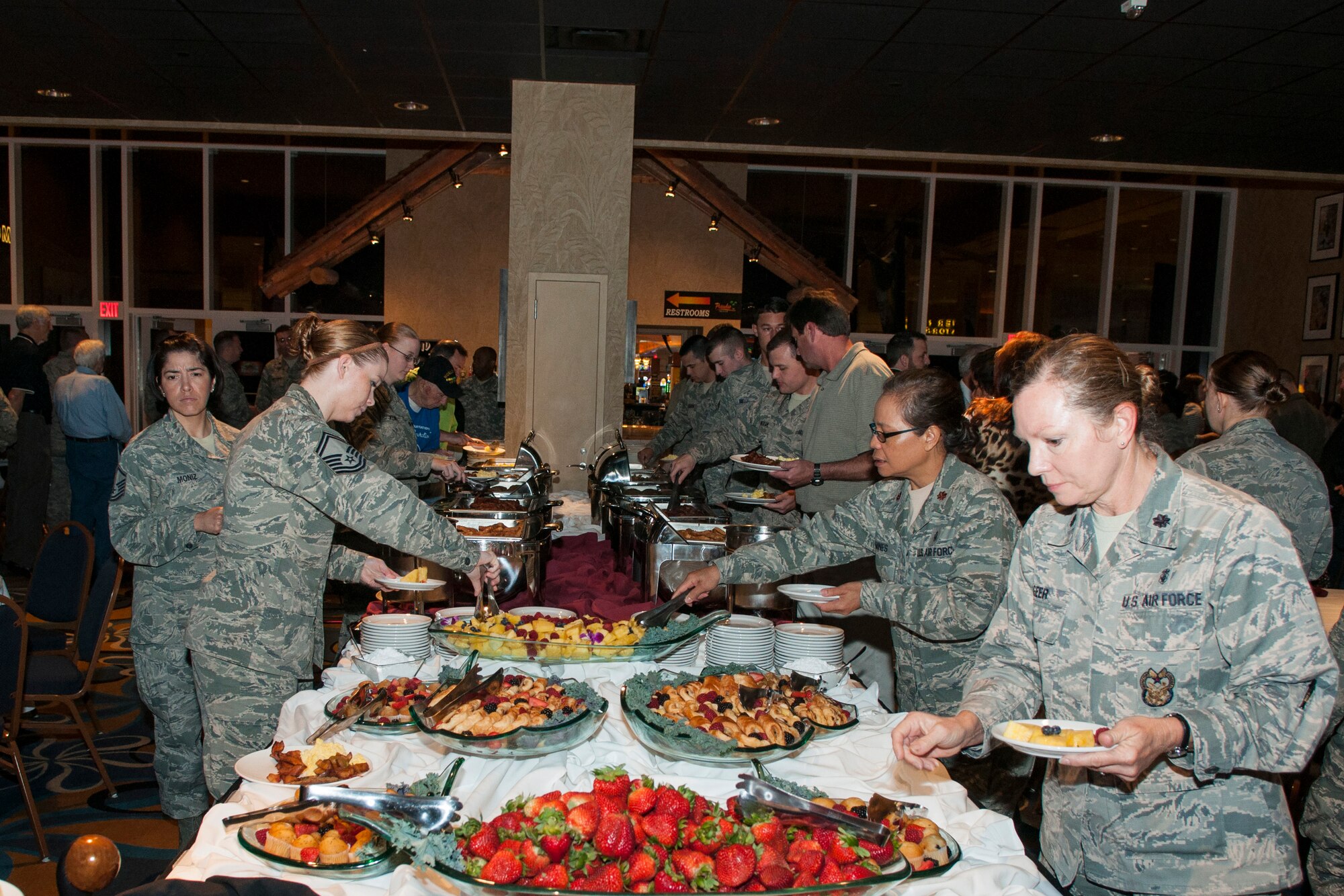 U.S. Air Force Airmen from Barksdale Air Force Base, La. go through the buffet line at the Bossier City Chamber of Commerce’s Military Appreciation Breakfast May 13, 2015 in Bossier City, La. This event was aimed to educate the community on local military units serving in their backyard, members of the Army, Navy, Marines and Air Force were nominated for recognition and the top selected units received the Unit of Excellence awards. (U.S. Air Force photo by Master Sgt. Dachelle Melville/Released)