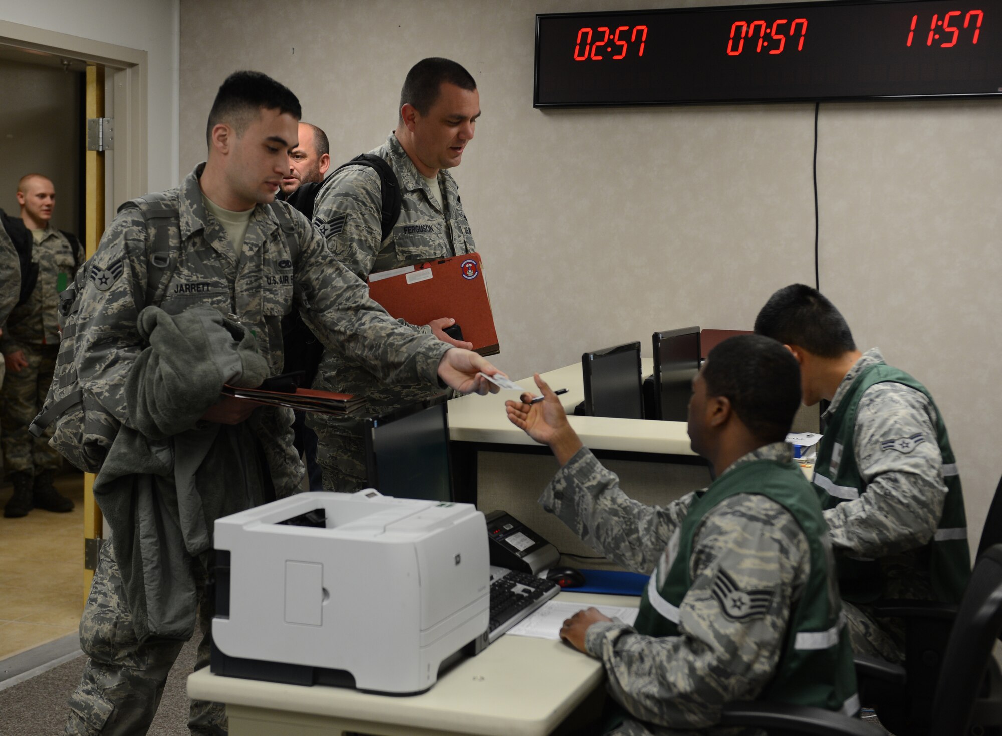 Airmen process through a terminal during a Constant Vigilance deployment exercise at Barksdale Air Force Base, Louisiana, May 5, 2015. Training and exercise participation are critical to Air Force Global Strike Command's ability to respond quickly and effectively to real-world situations. (U.S. Air Force photo/Senior Airman Benjamin Gonsier)