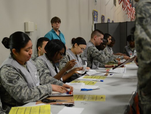 Airmen verify mobility paperwork for deploying personnel during a Constant Vigilance deployment exercise at Barksdale Air Force Base, Louisiana, May 5, 2015. Constant Vigilance is an annual Air Force Global Strike Command exercise designed to train and assess the command's ability to support its conventional and nuclear missions. (U.S. Air Force photo/Senior Airman Benjamin Gonsier) 
