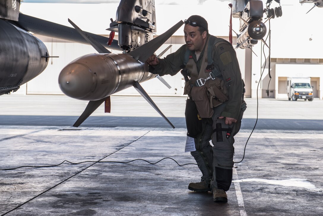 U.S. Air Force Capt. Brady Marsh, a 13th Fighter Squadron pilot deployed from Misawa Air Base, Japan, performs a final inspections on an F-16 Fighting Falcon on Eielson Air Force Base, Alaska, May 12, 2015, during RED FLAG-Alaska (RF-A) 15-2. RF-A is a series of Pacific Air Forces commander-directed field training exercises for U.S. and partner nation forces, providing combined offensive counter-air, interdiction, close air support and large force employment training in a simulated combat environment. (U.S. Air Force photo by Staff Sgt. Joshua Turner/Released)