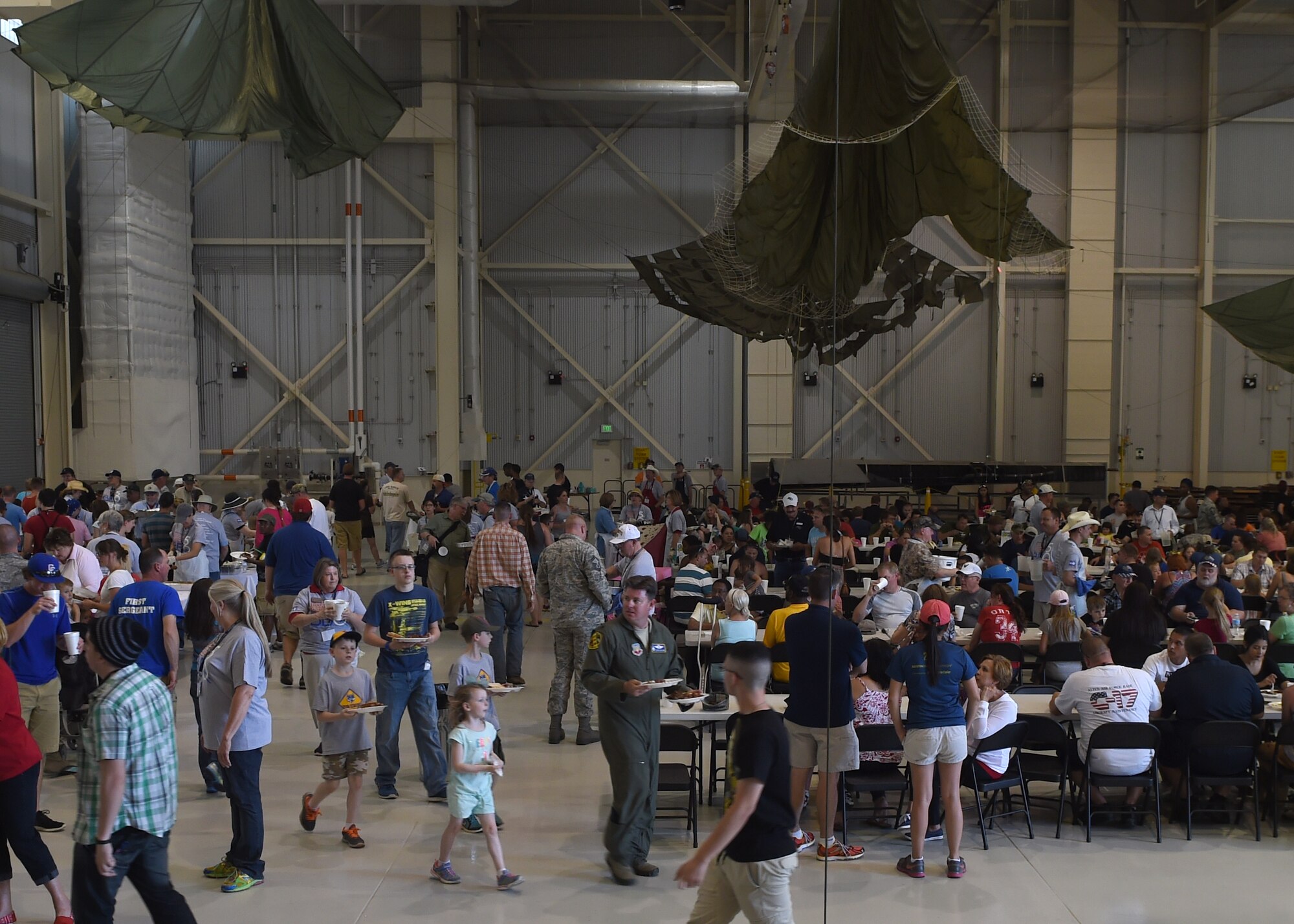 Military members and their families are served free meals at the 2015 World’s Largest Barbeque May 2, 2015, at Dyess Air Force Base, Texas. This year marked the 50th anniversary of the World’s Largest Barbeque, which is hosted by the Abilene Chamber of Commerce Military Affairs Committee. The annual event was hosted at Dyess for the first time in more than 40 years. (U.S. Air Force photo by Airman 1st Class Alexander Guerrero/Released)