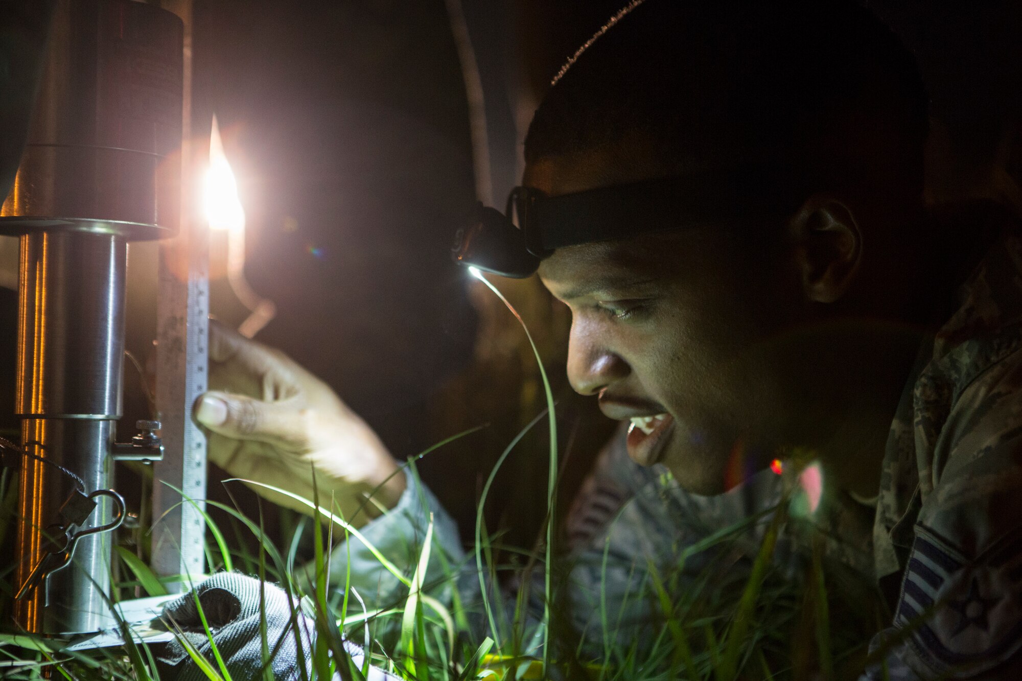 U.S. Air Force Staff Sgt. Edward Reid, with the 36th Contingency Response Group, Joint Task Force-505 and Hampton, Virginia native, collects measurements used to determine the geotechnical engineering properties of the soil at the Tribhuvan International Airport, Kathmandu, Nepal, May 8, 2015. The team tested the soil using a dynamic cone penetrometer to determine its stability following the 7.8 magnitude earthquake.  The pavement evaluation tested to see if there were any significant changes to the soil beneath the runway since the earthquake. Any changes could restrict weight limitations to incoming flights in order to prevent any runway damage. The Nepalese government requested the U.S. Government assistance after a 7.8 magnitude earthquake struck the country April 25, 2015. JTF-505 works in conjunction with USAID and the international community to provide unique capabilities to assist Nepal. (U.S. Marine Corps photo by MCIPAC Combat Camera Staff Sgt. Jeffrey D. Anderson/Released)