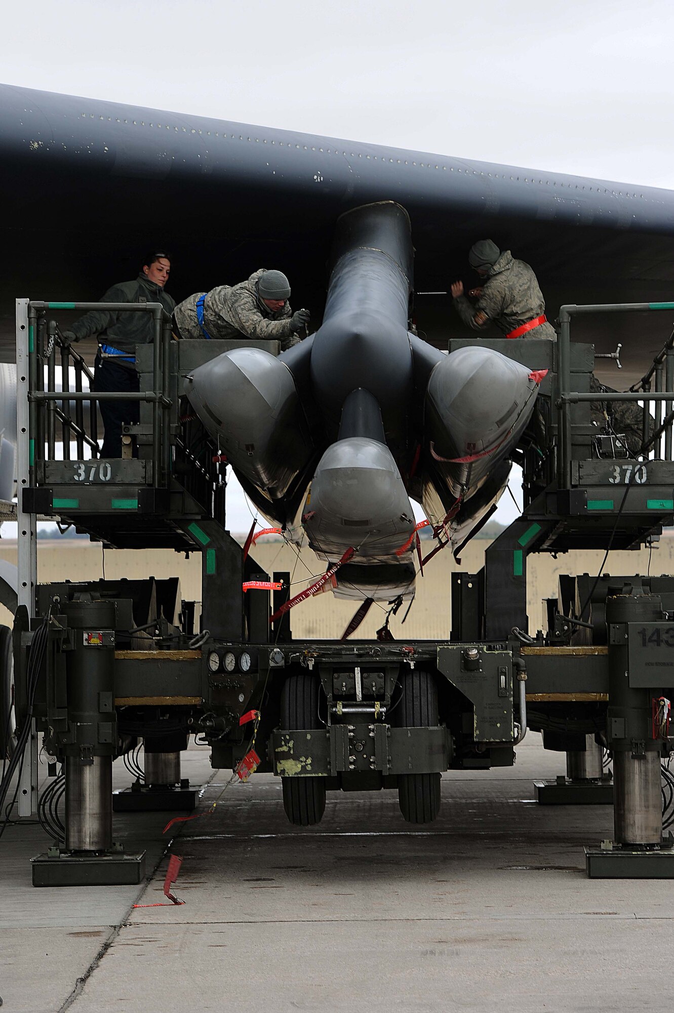 Weapons loaders assigned to Air Force Global Strike Command secure air-launched cruise missiles on a B-52H Stratofortress during a Constant Vigilance aircraft generation exercise at Minot Air Force Base, N.D., May 7, 2015. Exercises such as Constant Vigilance provide training opportunities to ensure AFGSC is ready to provide the President and combatant commanders with nuclear deterrence and long-range strike capabilities if and when called upon to do so. (U.S. Air Force photo/Senior Airman Kristoffer Kaubisch)