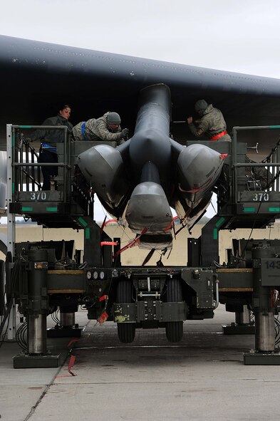 Weapons loaders assigned to Air Force Global Strike Command secure air-launched cruise missiles on a B-52H Stratofortress during a Constant Vigilance aircraft generation exercise at Minot Air Force Base, N.D., May 7, 2015. Exercises such as Constant Vigilance provide training opportunities to ensure AFGSC is ready to provide the President and combatant commanders with nuclear deterrence and long-range strike capabilities if and when called upon to do so. (U.S. Air Force photo/Senior Airman Kristoffer Kaubisch)
