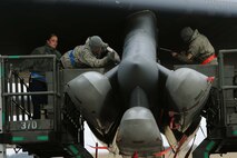 Weapons loaders assigned to Air Force Global Strike Command secure air-launched cruise missiles on a B-52H Stratofortress during a Constant Vigilance aircraft generation exercise at Minot Air Force Base, N.D., May 7, 2015. Training and exercise participation ensures AFGSC is ready to provide the President and combatant commanders with nuclear deterrence and long-range strike capabilities if and when called upon to do so. (U.S. Air Force photo/Senior Airman Kristoffer Kaubisch)