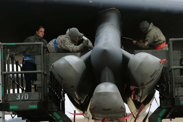 Weapons loaders assigned to Air Force Global Strike Command secure air-launched cruise missiles on a B-52H Stratofortress during a Constant Vigilance aircraft generation exercise at Minot Air Force Base, N.D., May 7, 2015. Training and exercise participation ensures AFGSC is ready to provide the President and combatant commanders with nuclear deterrence and long-range strike capabilities if and when called upon to do so. (U.S. Air Force photo/Senior Airman Kristoffer Kaubisch)