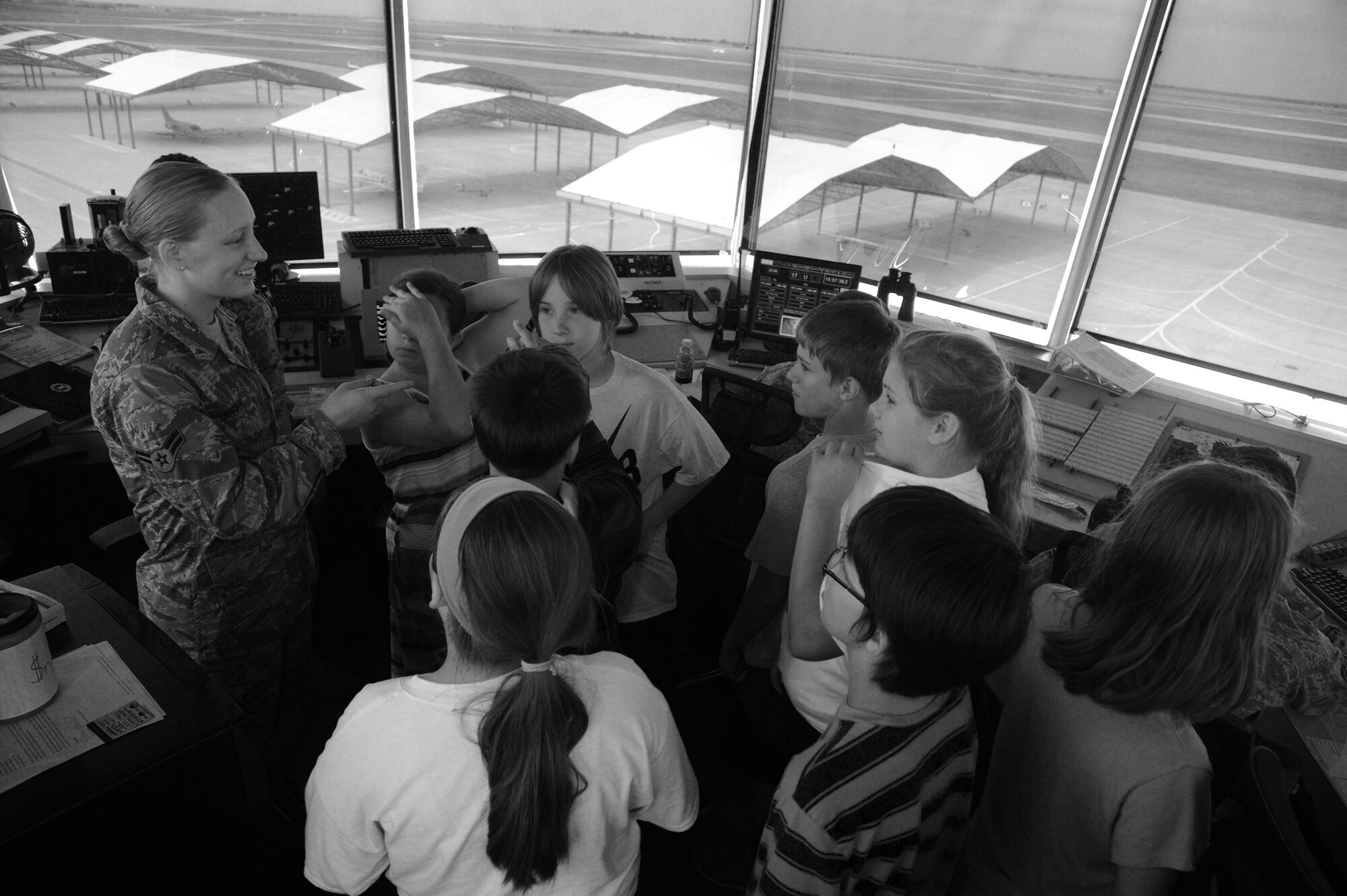 Airman 1st Class Caitlin Niemann, a 71st Operations Support Squadron air traffic controller, explains to a group of Enid fifth-graders how she and her fellow Airmen direct student pilots safely via the air traffic control tower, May 7. The students were here from Hayes Elementary School for the 5th Flying Training Squadron’s Flight of Dreams tour. (U.S. Air Force photo/Senior Airman Frank Casciotta)