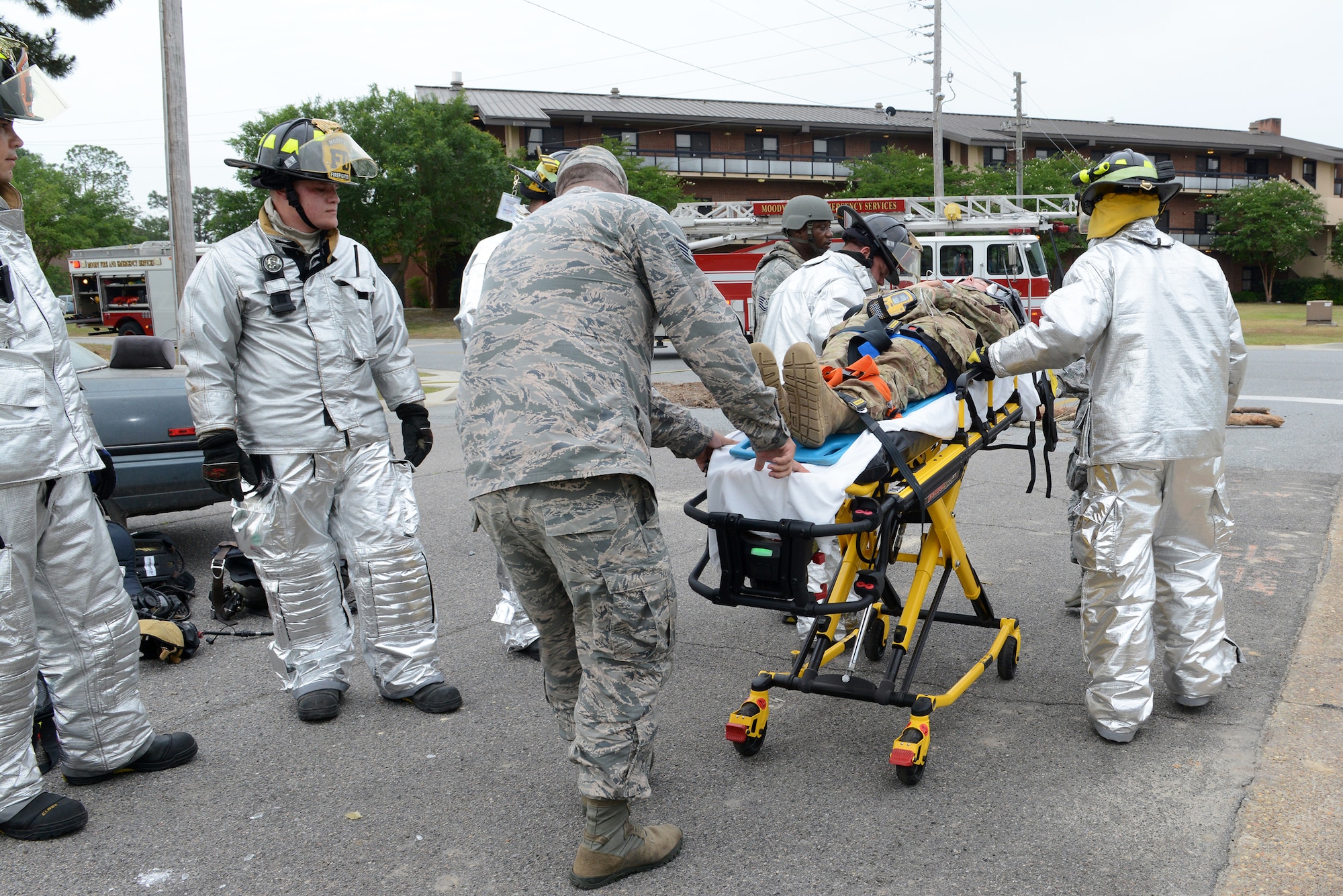 U.S. Air Force Staff Sgt. Amber Goedde, 23d Explosive Ordnance Disposal flight craftsman, is transported to an ambulance by first responders during the Hurricane Response exercise May 13, 2015, at Moody Air Force Base, Ga. Inspectors from Air Combat Command teamed up with 23d Wing Inspector General personnel to evaluate the exercise. (U.S. Air Force photo by Airman 1st Class Kathleen D. Bryant/Released) 