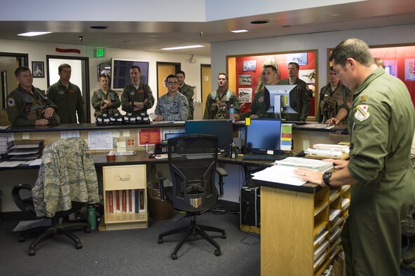 U.S. Air Force Staff Sgt. William Heines, an 18th Aggressor Squadron baron controller, stands as the only enlisted member during a pre-flight briefing for a Red Flag-Alaska (RF-A) 15-2 sortie May 12, 2015, at Eielson Air Force Base, Alaska. During RF-A, robust and accurate air war scenarios are enhanced by the barons who present ground threats and various types of jamming to provide problems blue forces will have to solve in order to gain and maintain air superiority. (U.S. Air Force photo by Staff Sgt. Shawn Nickel/Released)