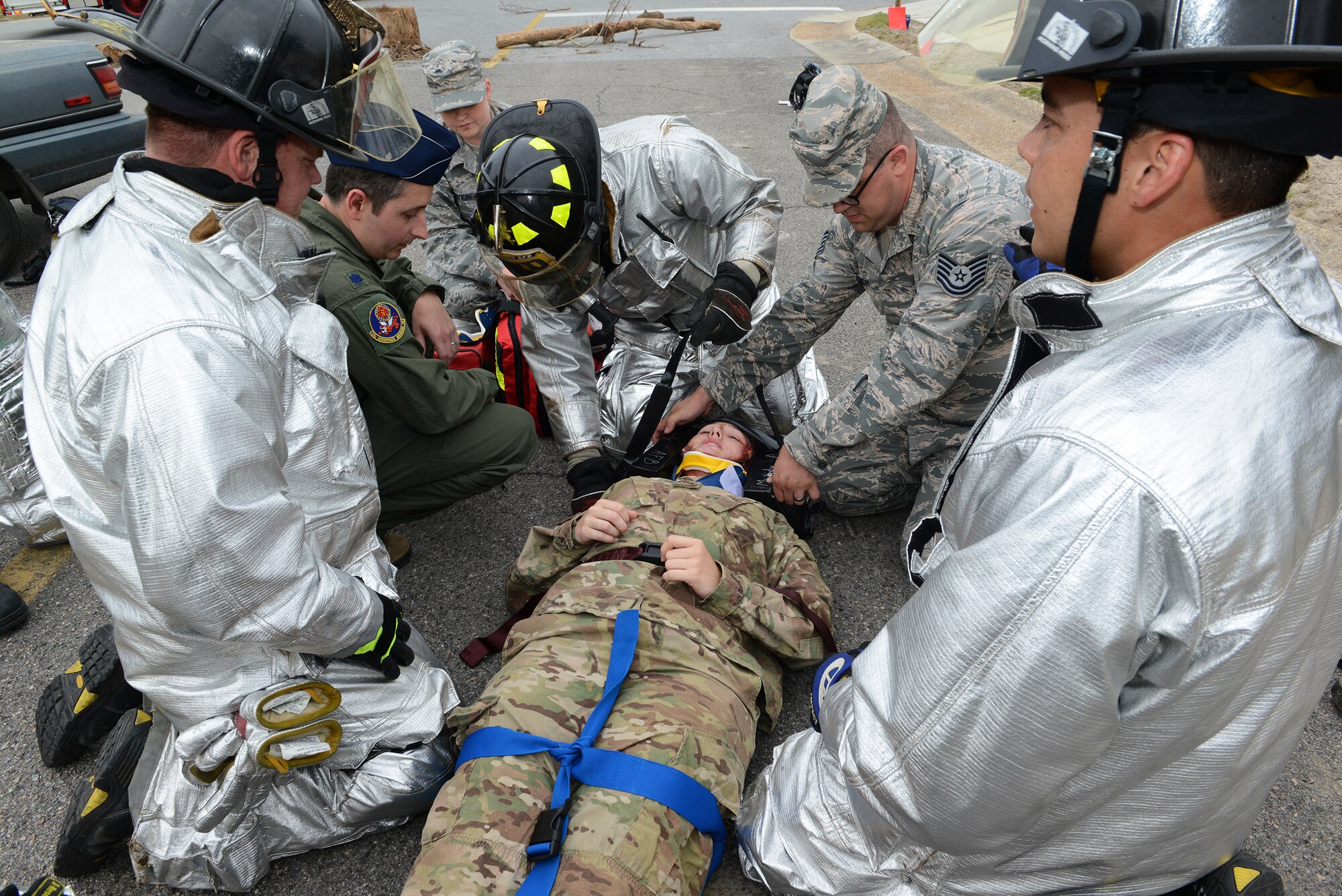 Moody first responders check the vitals of U.S. Air Force Staff Sgt. Amber Goedde, 23d Explosive Ordnance Disposal flight craftsman, during the Hurricane Response exercise May 13, 2015, at Moody Air Force Base, Ga. This exercise put an emphasis on Installation Recovery Procedures, whereas previous hurricane exercises focused on evacuation procedures of critical assets. (U.S. Air Force photo by Airman 1st Class Kathleen D. Bryant/Released)
