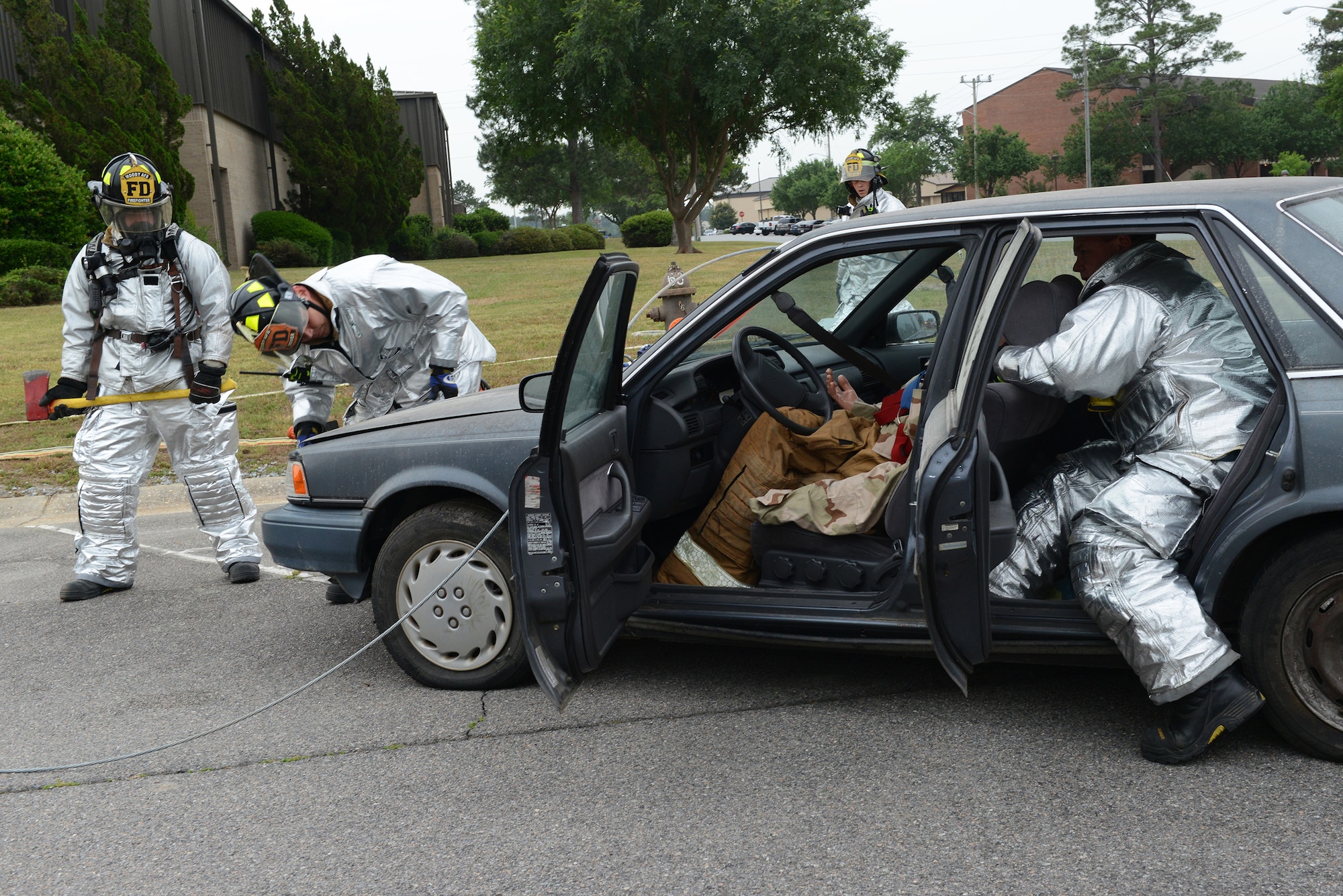 Moody firefighters respond to a simulated car accident during the Hurricane Response exercise May 13, 2015, at Moody Air Force Base, Ga. Team Moody began the exercise May 11, 2015 to test the base's overall readiness and recovery measures. (U.S. Air Force photo by Airman 1st Class Kathleen D. Bryant/Released)
