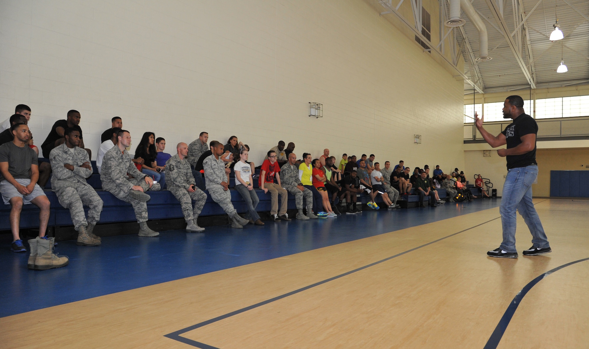 Former Ultimate Fighting Championship light-heavyweight champion Rashad Evans speaks to Airmen during an event at Barksdale Air Force Base, Louisiana, May 8, 2015. Evans and former UFC fighter-turned nutritionist Mike Dolce came to Barksdale to discuss mental and physical health, nutrition and motivation with Airmen and their families. (U.S. Air Force photo/Senior Airman Joseph Raatz)