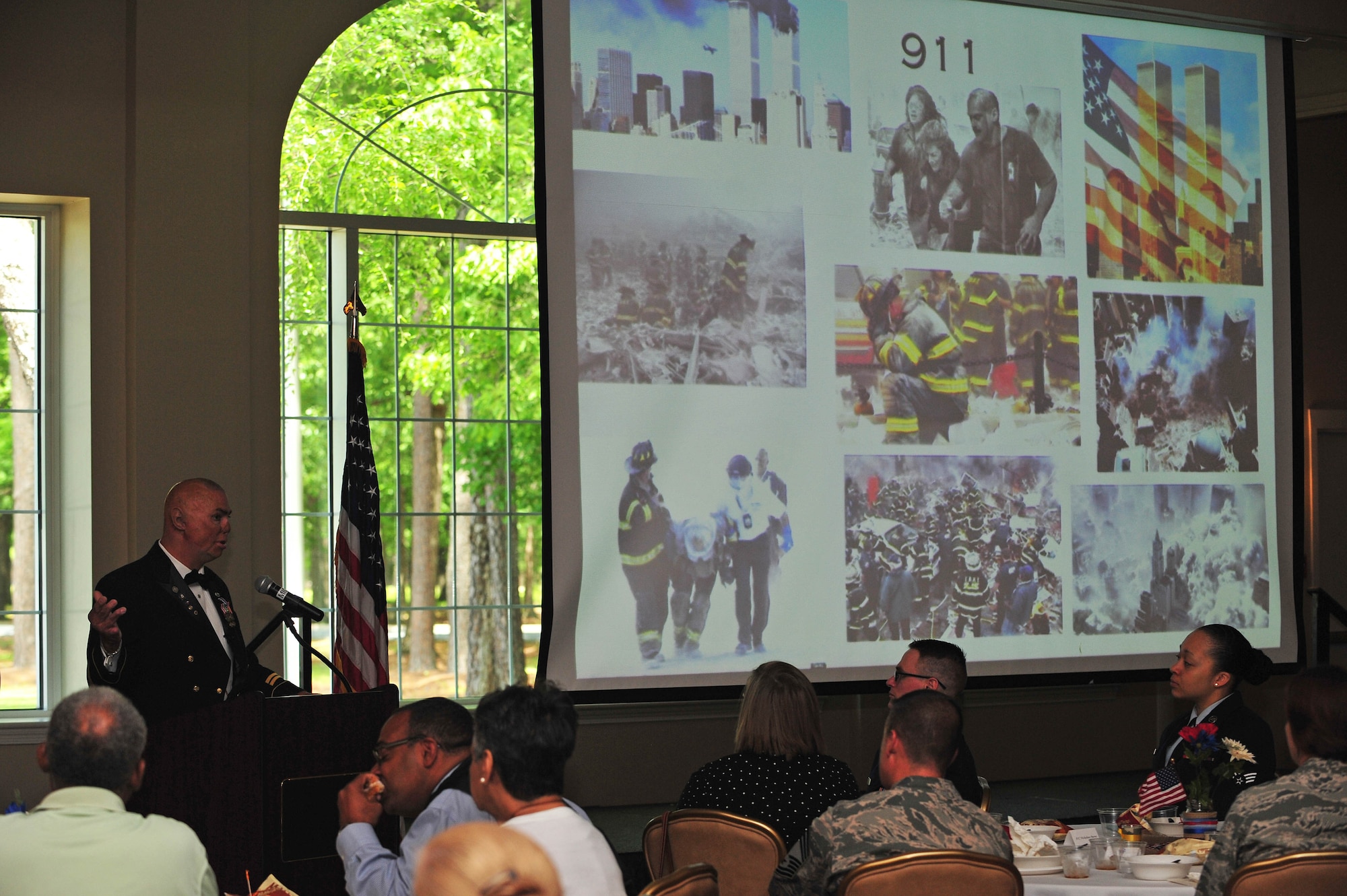 Retired Army Staff Sgt. Shilo Harris addresses the audience during the National Prayer Breakfast, May 7, 2015, at Seymour Johnson Air Force Base, North Carolina. During his second deployment to Southwest Asia, Harris’ vehicle was struck by an improvised explosive device, which resulted in the deaths of three of his best friends, as well as multiple injuries to himself and the driver. (U.S. Air Force photo/Senior Airman John Nieves Camacho)