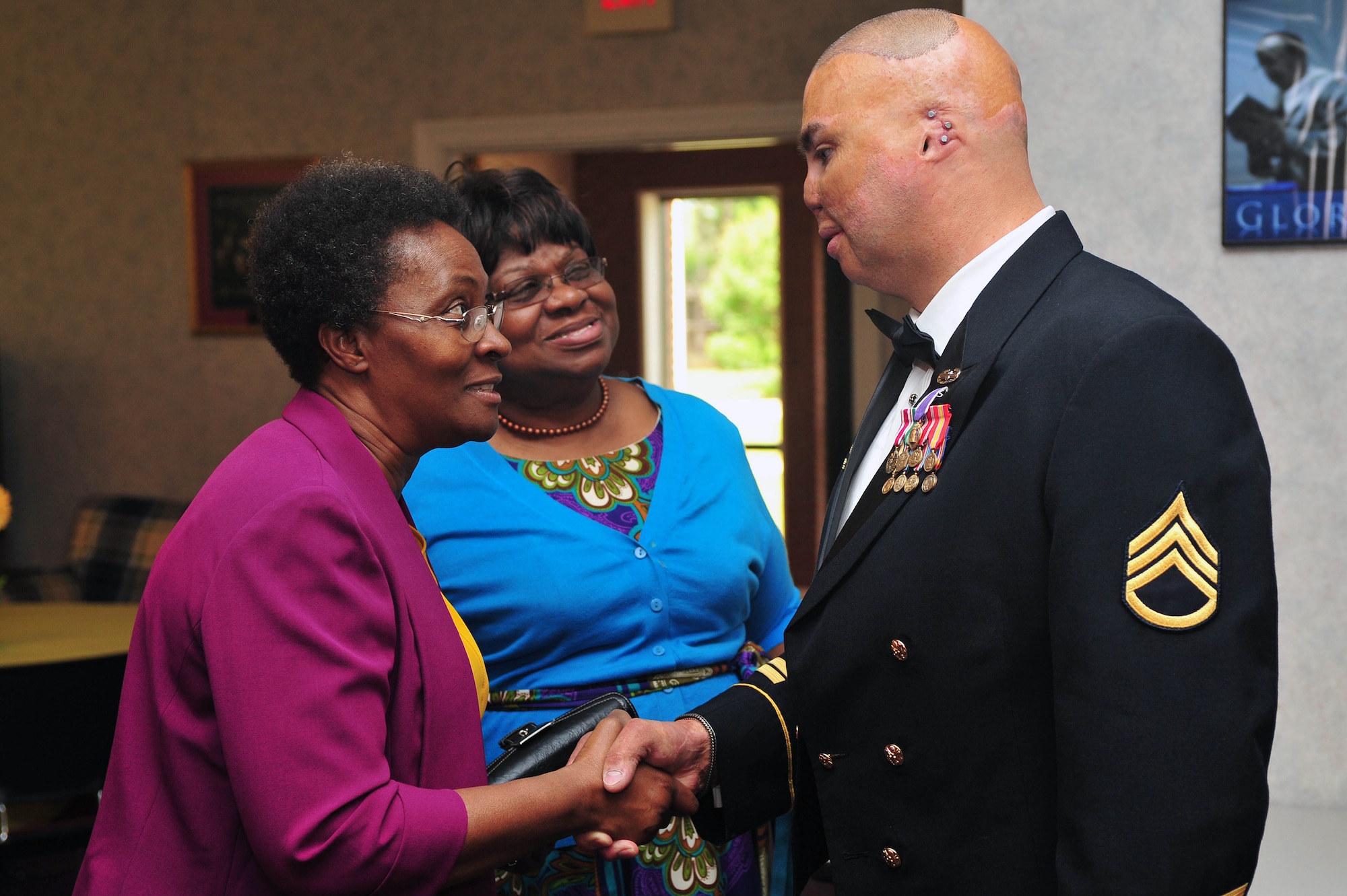 Retired Army Staff Sgt. Shilo Harris meets with members of Team Seymour, May 7, 2015, at Seymour Johnson Air Force Base, North Carolina. Harris visited the base to share his experiences as a wounded warrior during the National  Prayer Breakfast. (U.S. Air Force photo/Senior Airman John Nieves Camacho)