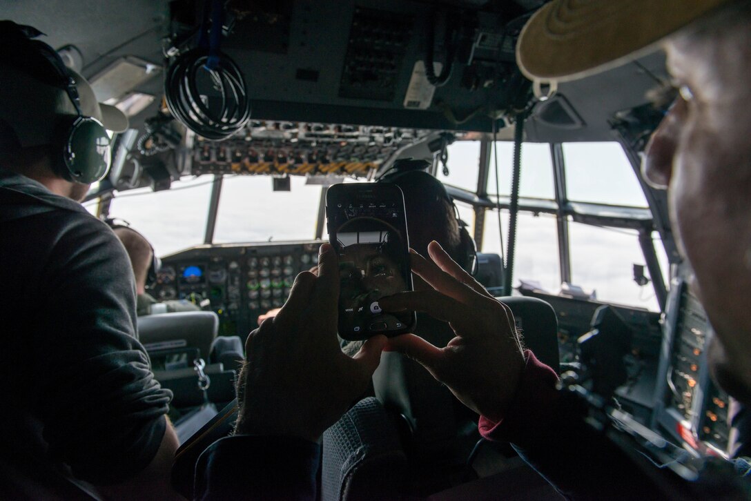 Air Traffic Controllers from Minneapolis-St. Paul fly get a view from the cockpit of  a 934th Airlift Wing C-130 during a familiarization flight May 6. (Air Force Photo/Staff Sgt. Trevor Saylor)