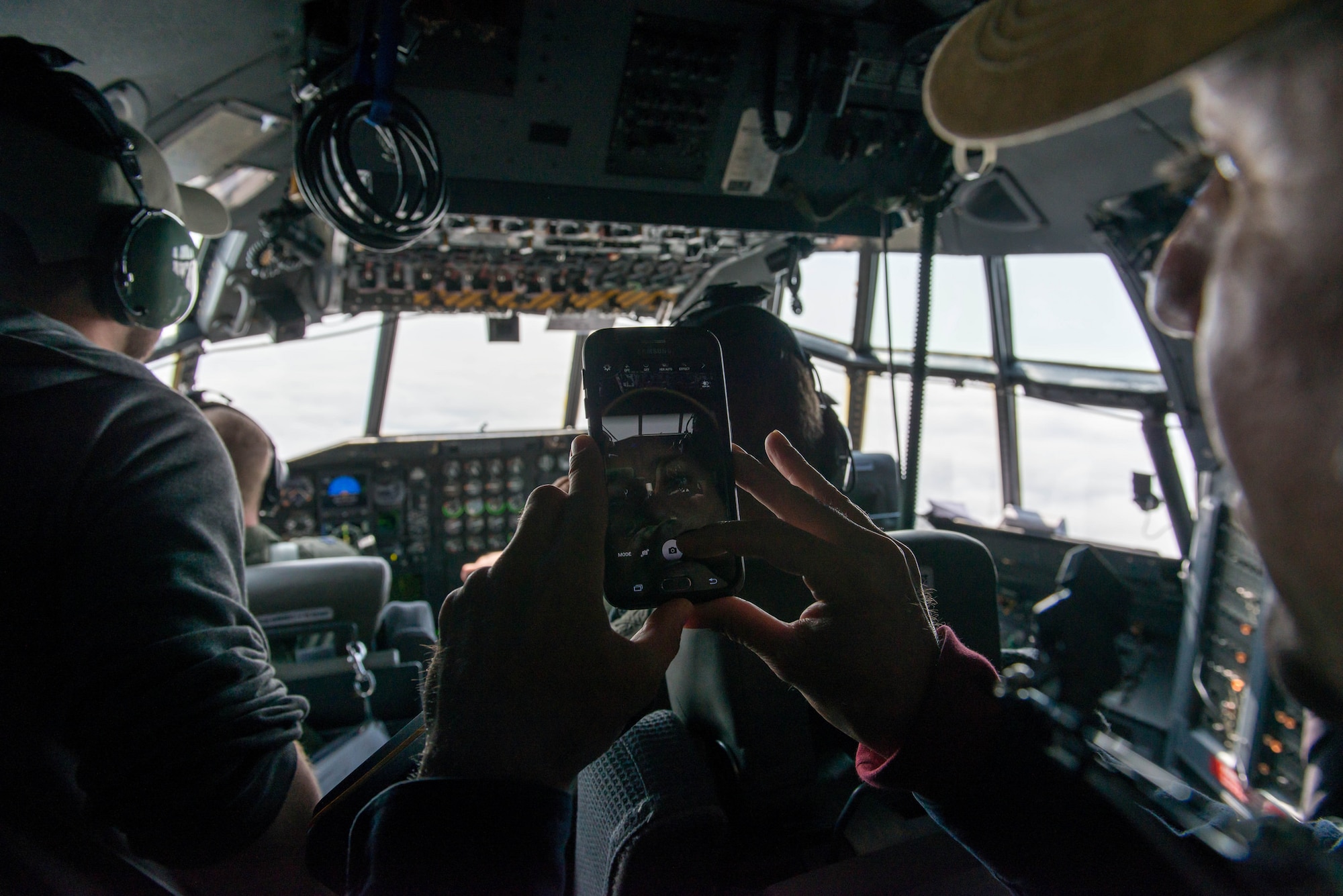 Air Traffic Controllers from Minneapolis-St. Paul fly get a view from the cockpit of  a 934th Airlift Wing C-130 during a familiarization flight May 6. (Air Force Photo/Staff Sgt. Trevor Saylor)